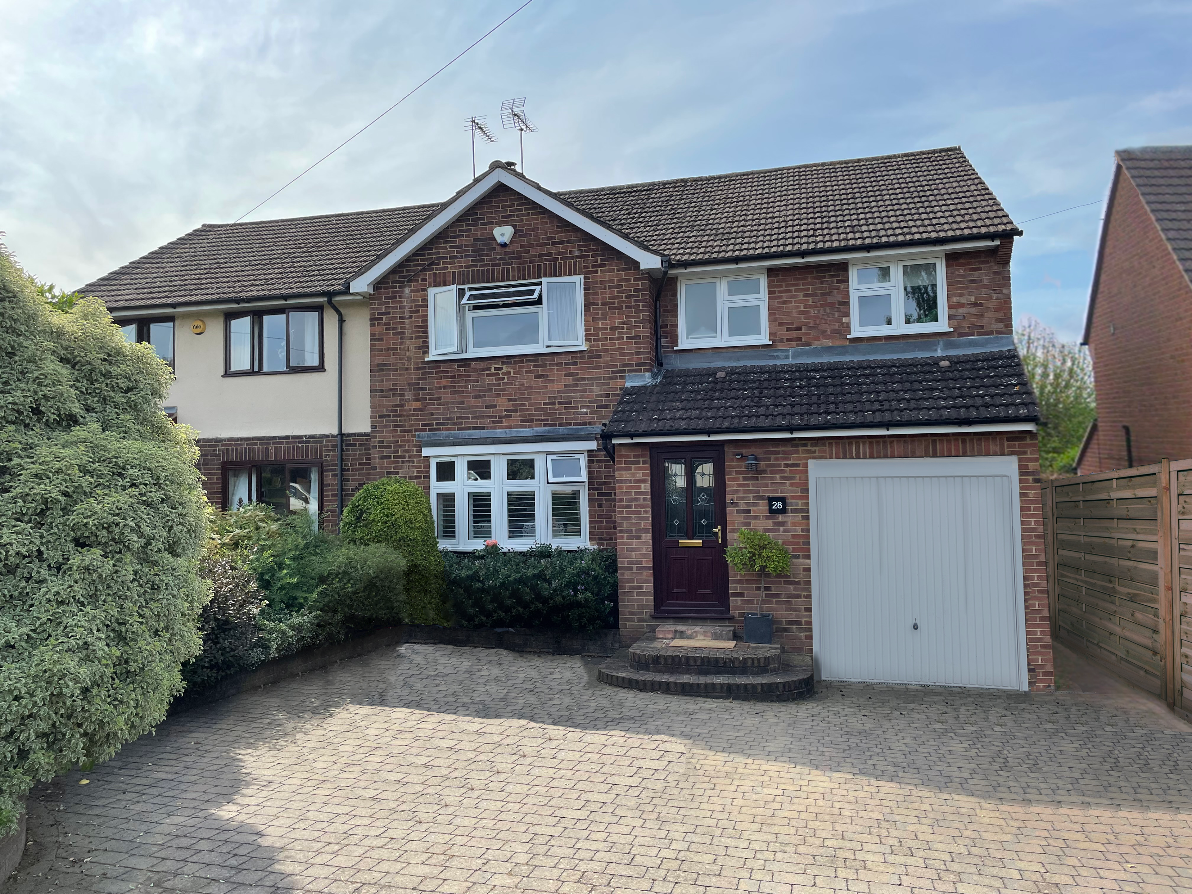Addition of a garage door to cover an extension's window