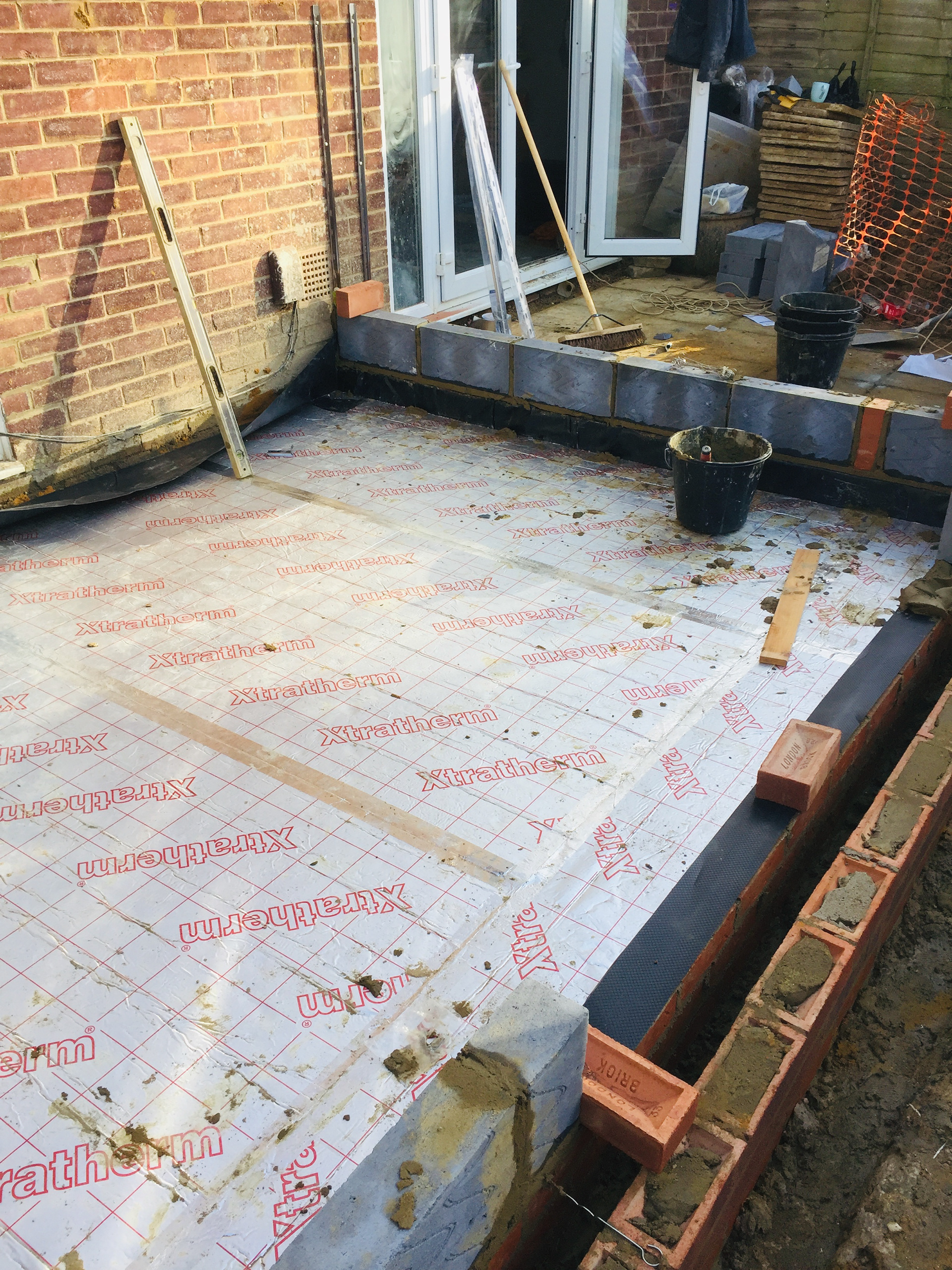 Insulation panels were laid before the concrete is poured.
