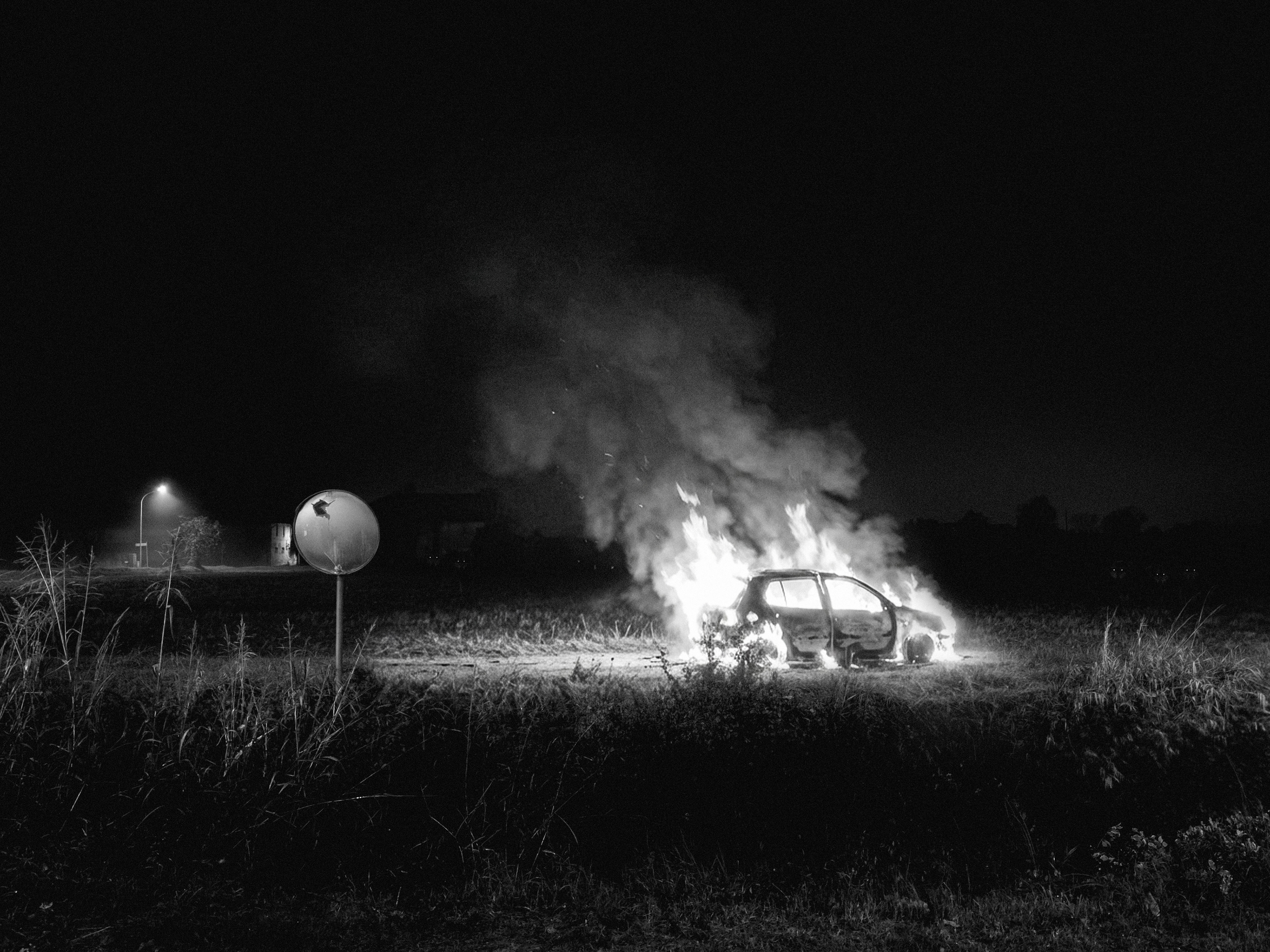 Digital artwork · Original photography · Creativity enhanced by AI (Burned car and wolves)