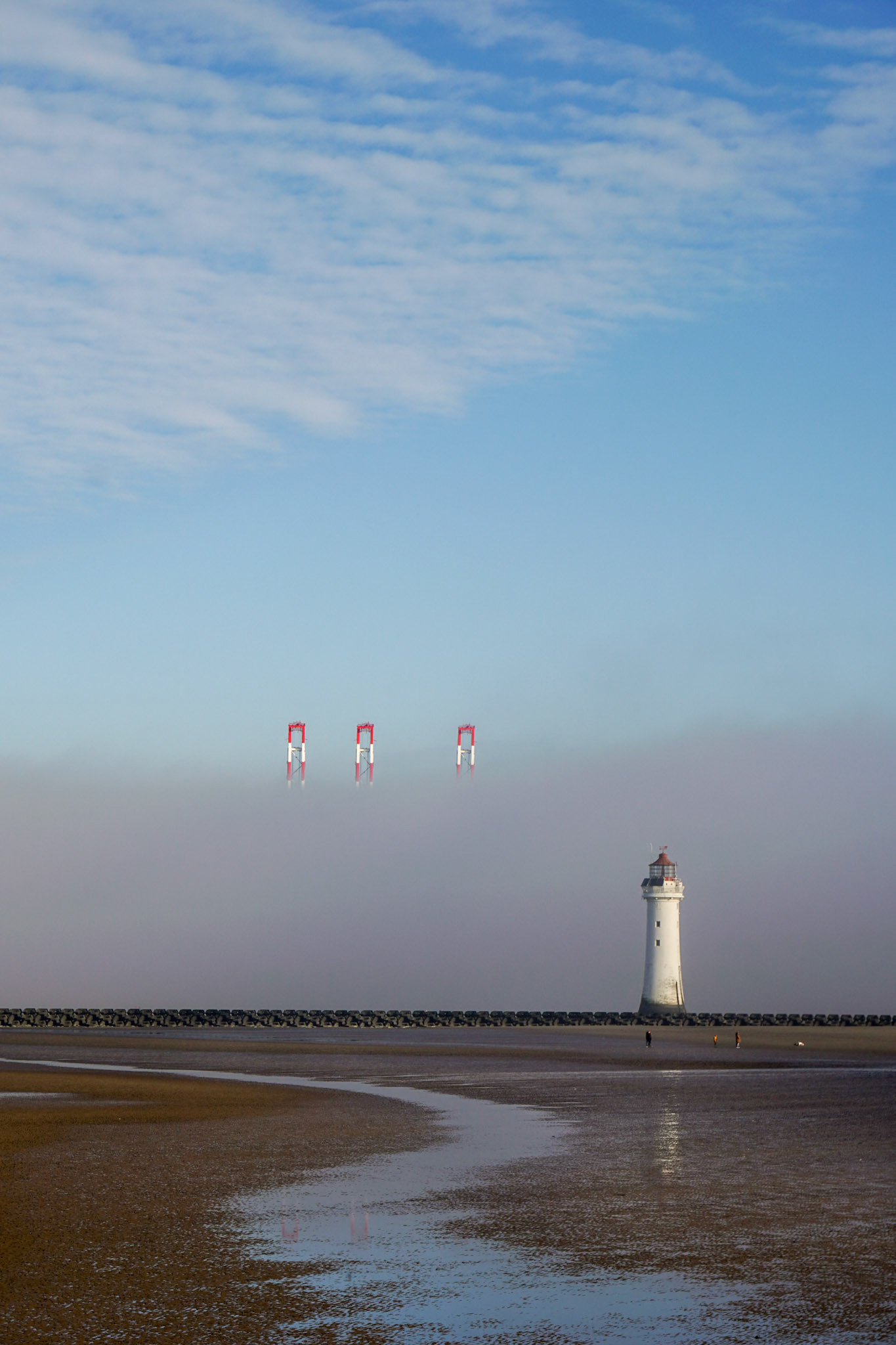 Perch Rock lighthouse. Liverpool docks in the fog