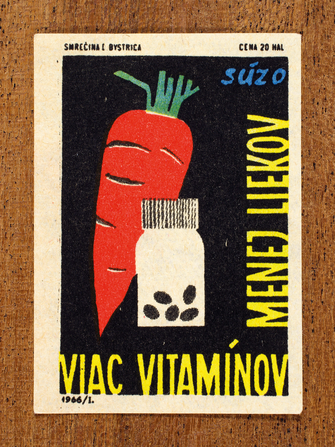 Vintage 1966 Czech matchbox label by Solo Smrečina B. Bystrica featuring a carrot and medicine bottle on black. It promotes having a healthy diet, rather than relying on medicines to fix preventable illnesses.
