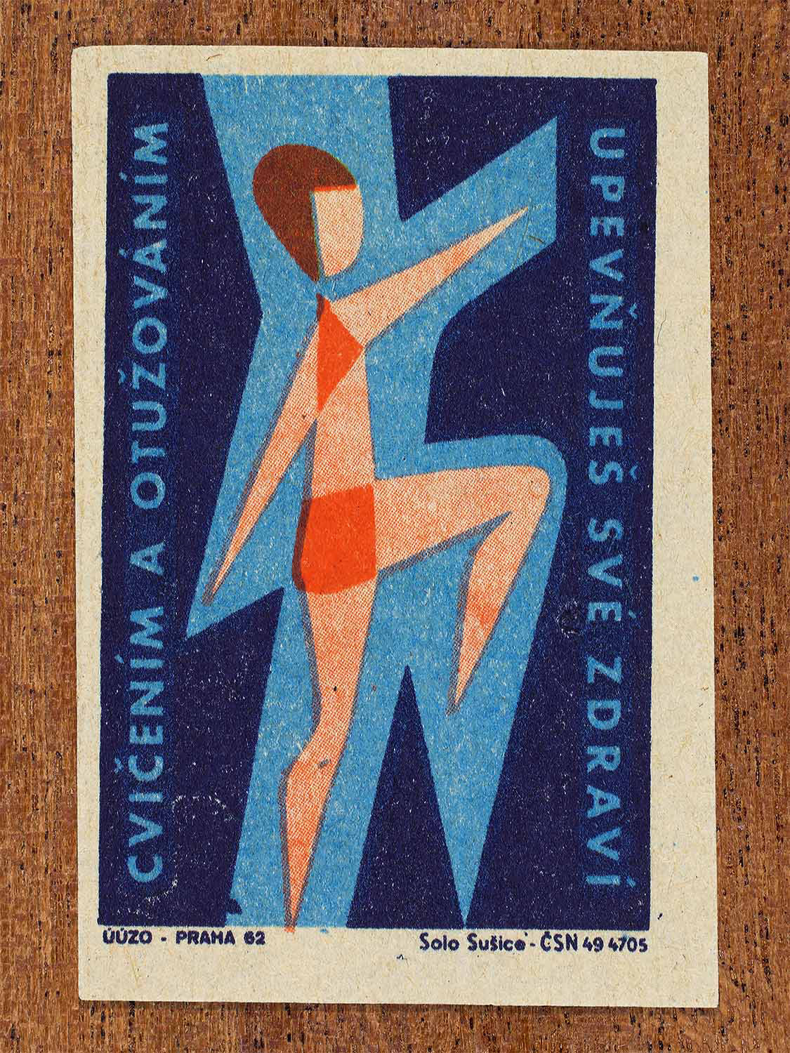 Vintage 1962 Czech matchbox label by Solo Sušice featuring a stylized female figure wearing a swimming costume, and outlined in blue. Part of the 'Protect Health' series promoting cold-water hardening to build resistance and health.