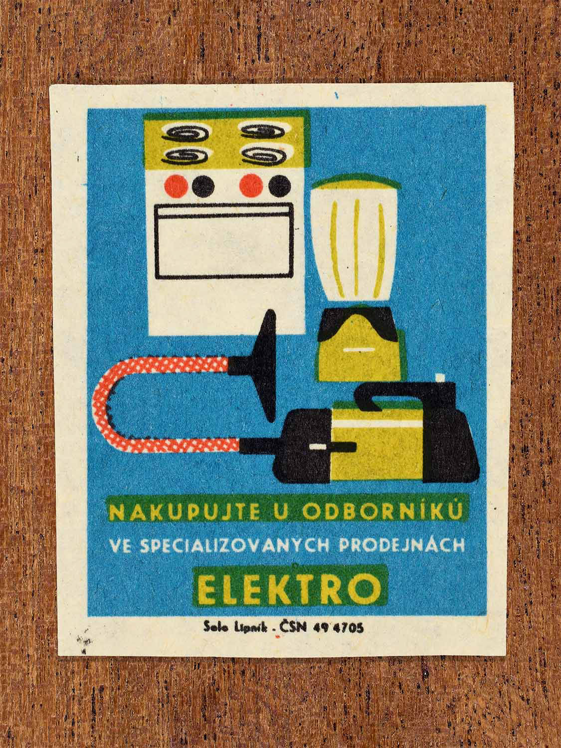 Vintage c. 1967 Czech matchbox label showing a blender, electric cooker and vacuum cleaner in blue, yellow, red and black colours. Produced by the Solo Lipník match factory to promote shopping for electrical appliances in specialised retail stores.