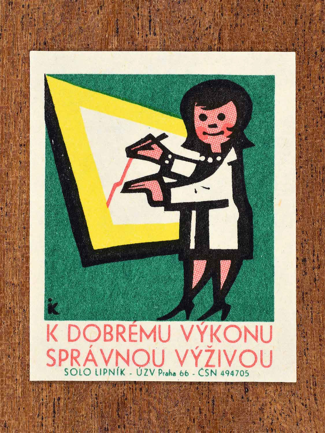 Vintage 1966 Czech matchbox label showing a female health or education worker pointing at a chart. Produced by the Solo Lipník match factory to promote proper nutrition through health education.