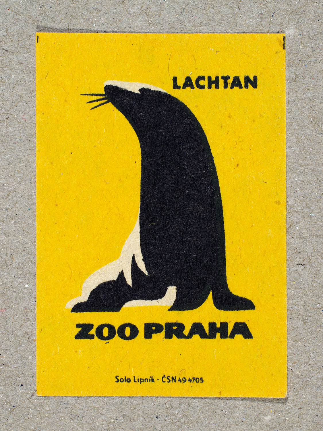 Vintage 1963 Czech matchbox label by Solo Lipník featuring a sea lion on a yellow background. Part of the 'Zoo Praha' series advertising Prague Zoo in Czechoslovakia.