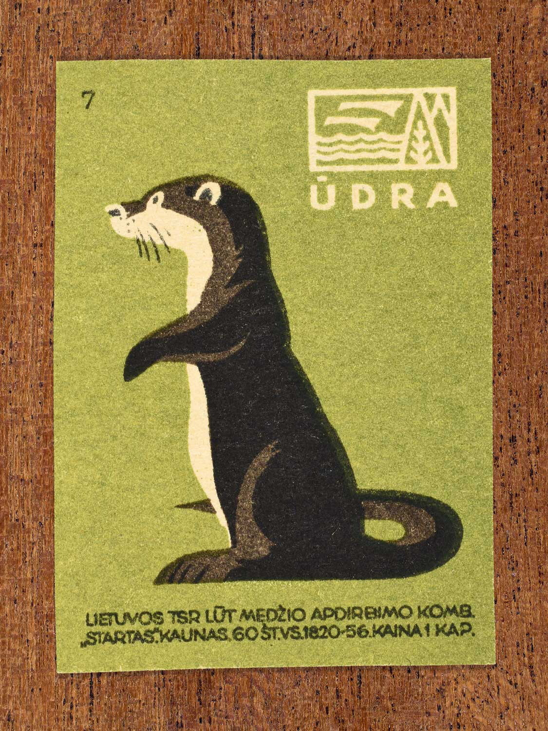 Vintage 1959 Lithuanian matchbox label showing a stylised otter standing upright, on green background. Produced by the LŪT Wood Processing Combine “Startas” in Kaunas to familiarise citizens with local wildlife.