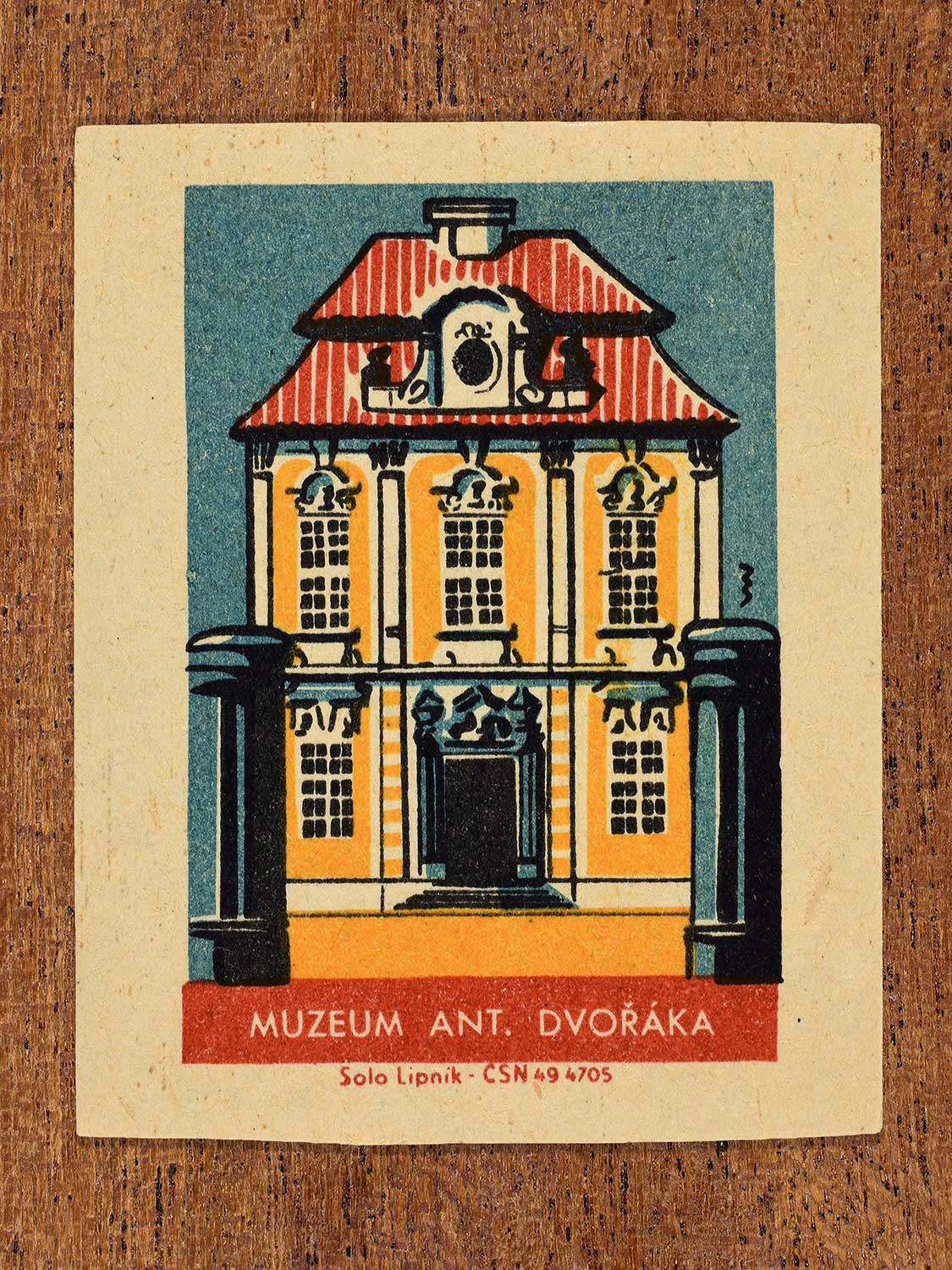 Vintage 1964 Czechoslovakia matchbox label showing the Muzeum Ant. Dvořáka (Antonín Dvořák Museum) in yellow, red and teal colours. Produced by the Solo Lipník match factory to promote domestic historical heritage and municipal institutions across the state.