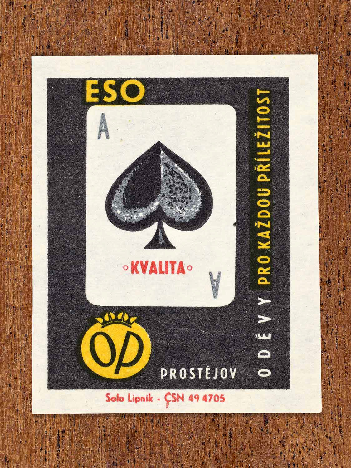Vintage 1966 Czech matchbox label showing an ace of spades playing card in black and grey. Produced by the Solo Lipník match factory to emphasise the quality of OP Prostějov clothing.