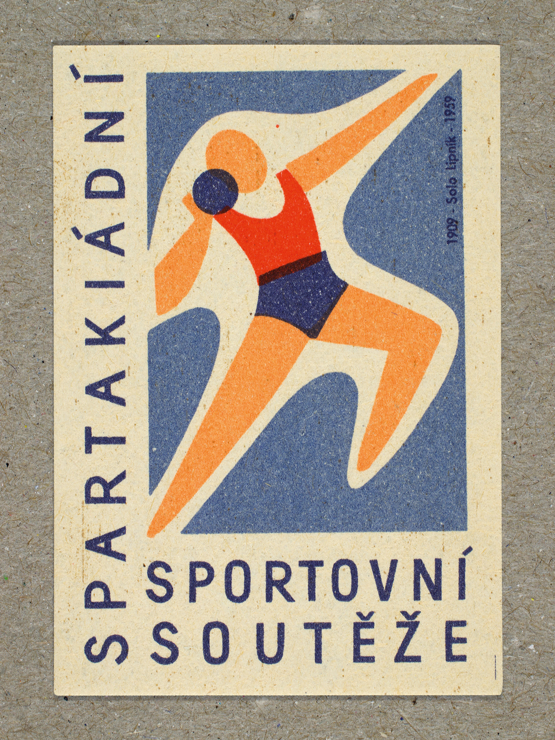 Vintage 1959 Czech matchbox label featuring a stylised figure holding a small ball pressed to the neck with extended arms and legs, in blue and red colours. Produced by Solo Lipník & Solo Sušice match factory to promote the nationwide Spartakiad sports programme in Czechoslovakia.