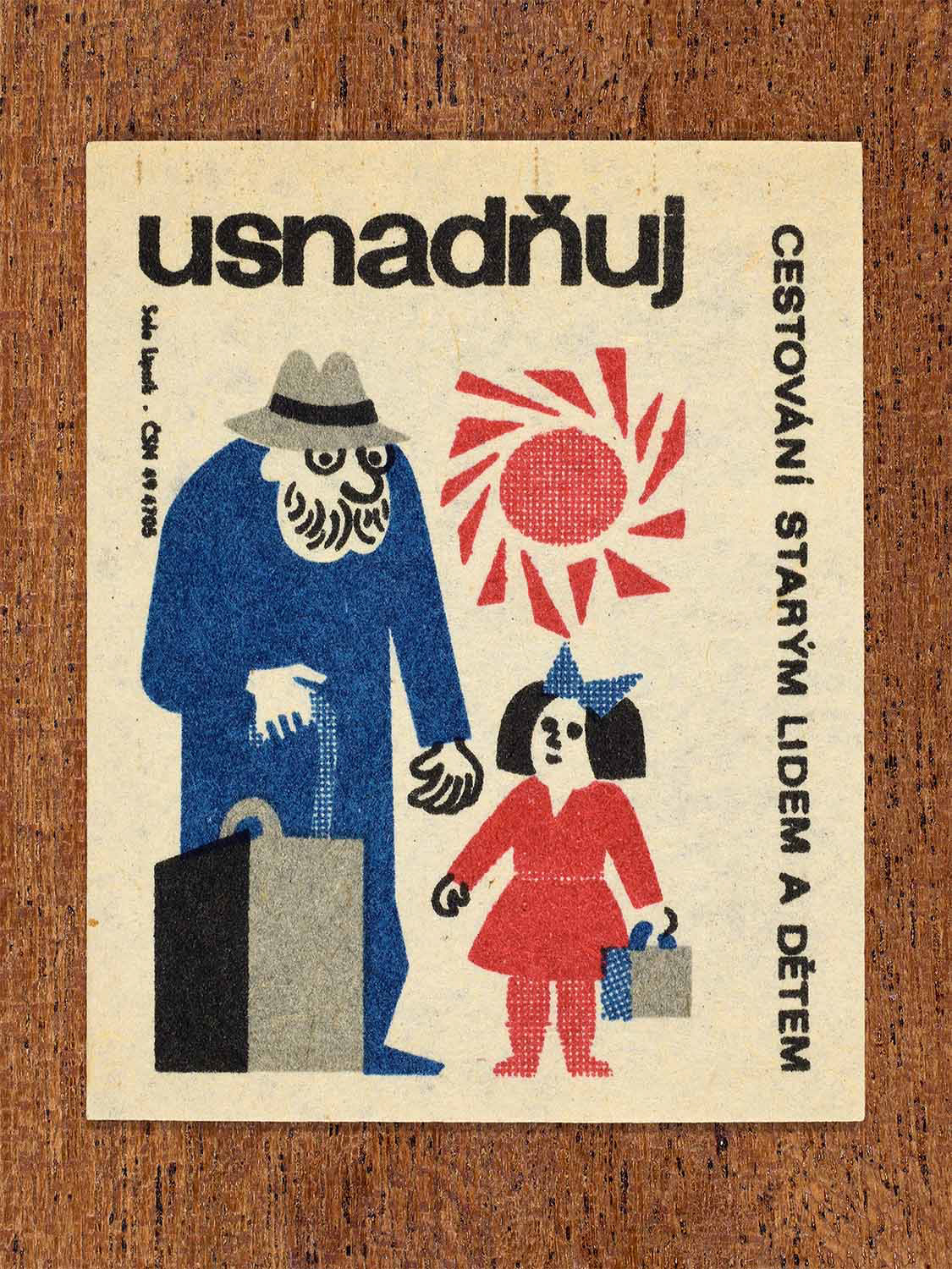 Vintage c. 1964 Czech matchbox label showing an elderly man and a young child with luggage, illustrated in blue, red and black. Produced by the Solo Lipník match factory to encourage helping elderly people and children while travelling.