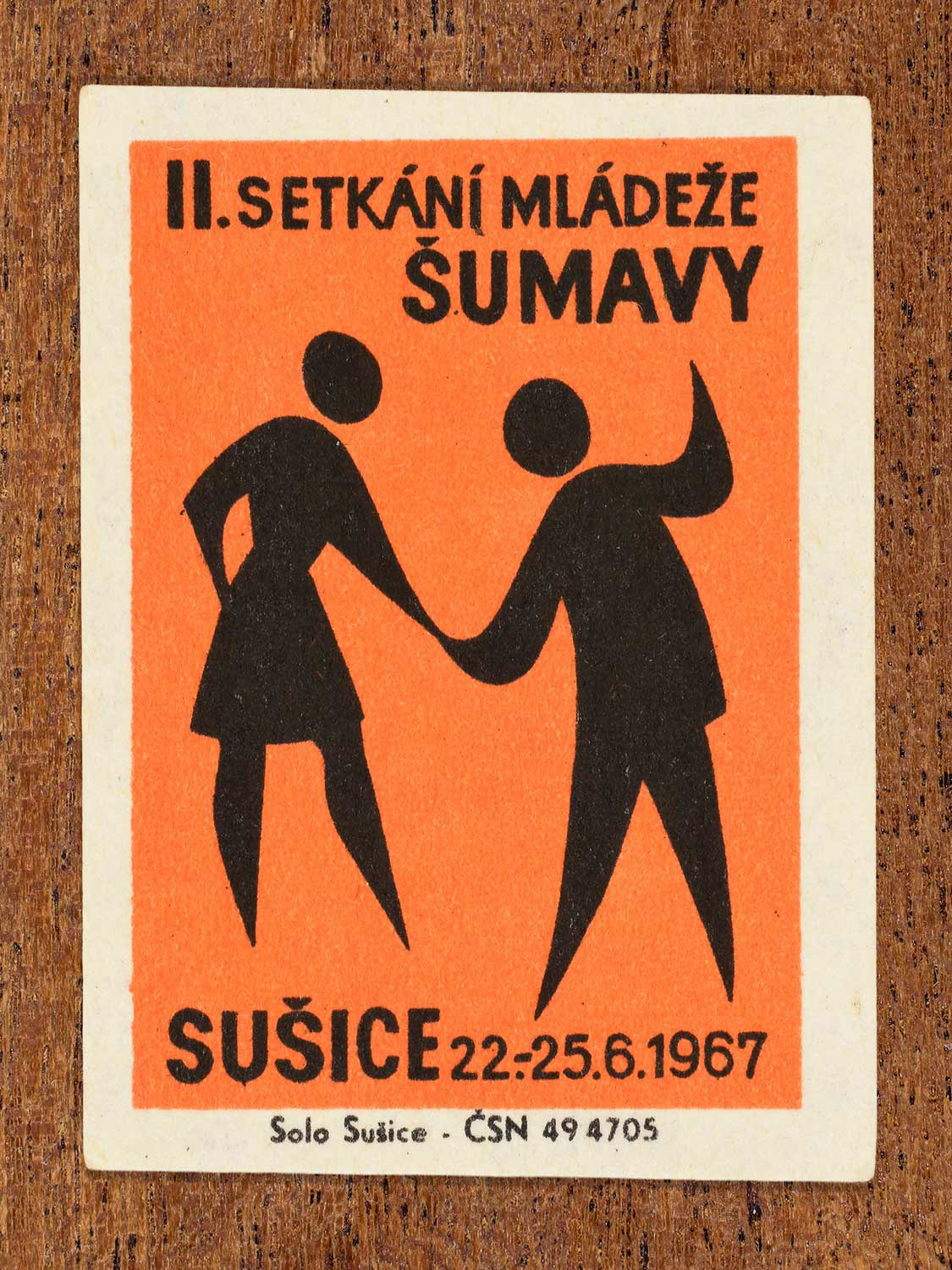 Vintage 1967 Czech matchbox label showing a young couple dancing hand in hand. Produced by the Solo Sušice match factory to promote social unity and communal youth activities.