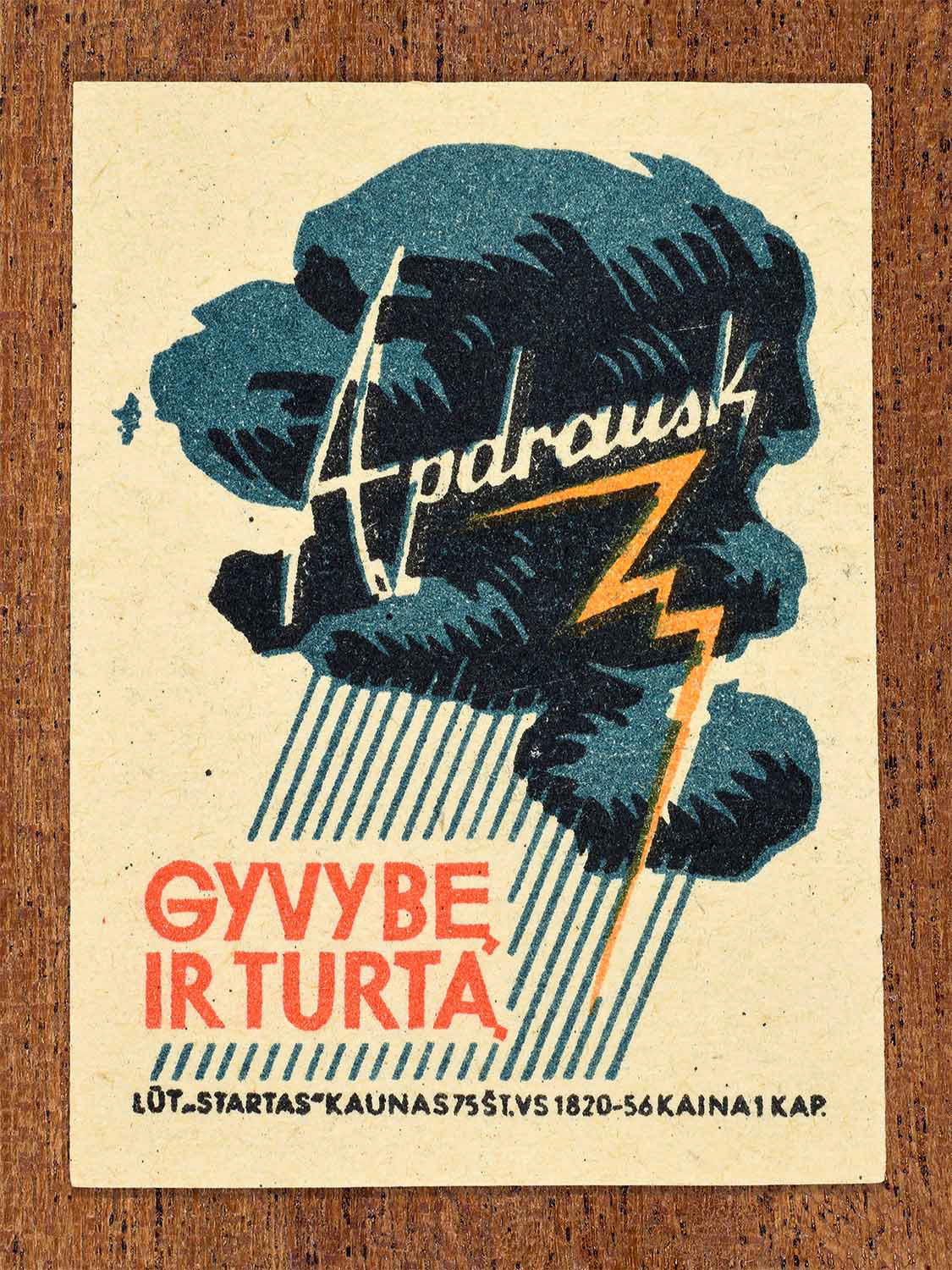 Vintage 1963 Lithuanian matchbox label showing dark storm clouds with lightning in blue, orange, and black colours. Produced by the Startas Kaunas match factory to promote insurance for life and property.