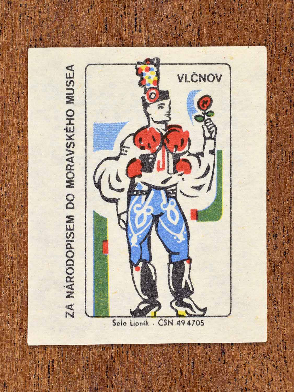 Vintage 1968 Czech matchbox label showing a male ceremonial folk costume from Vlčnov with traditional headgear. Produced by the Solo Lipník match factory to promote Moravian folk traditions via the Moravian Museum.
