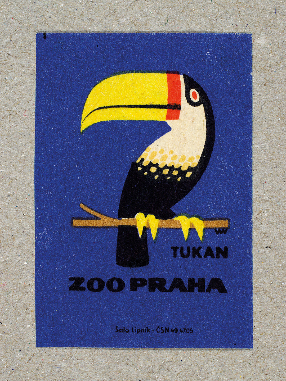 Vintage 1963 Czech matchbox label by Solo Lipník featuring a tucan on a blue background. Part of the 'Zoo Praha' series advertising Prague Zoo in Czechoslovakia.
