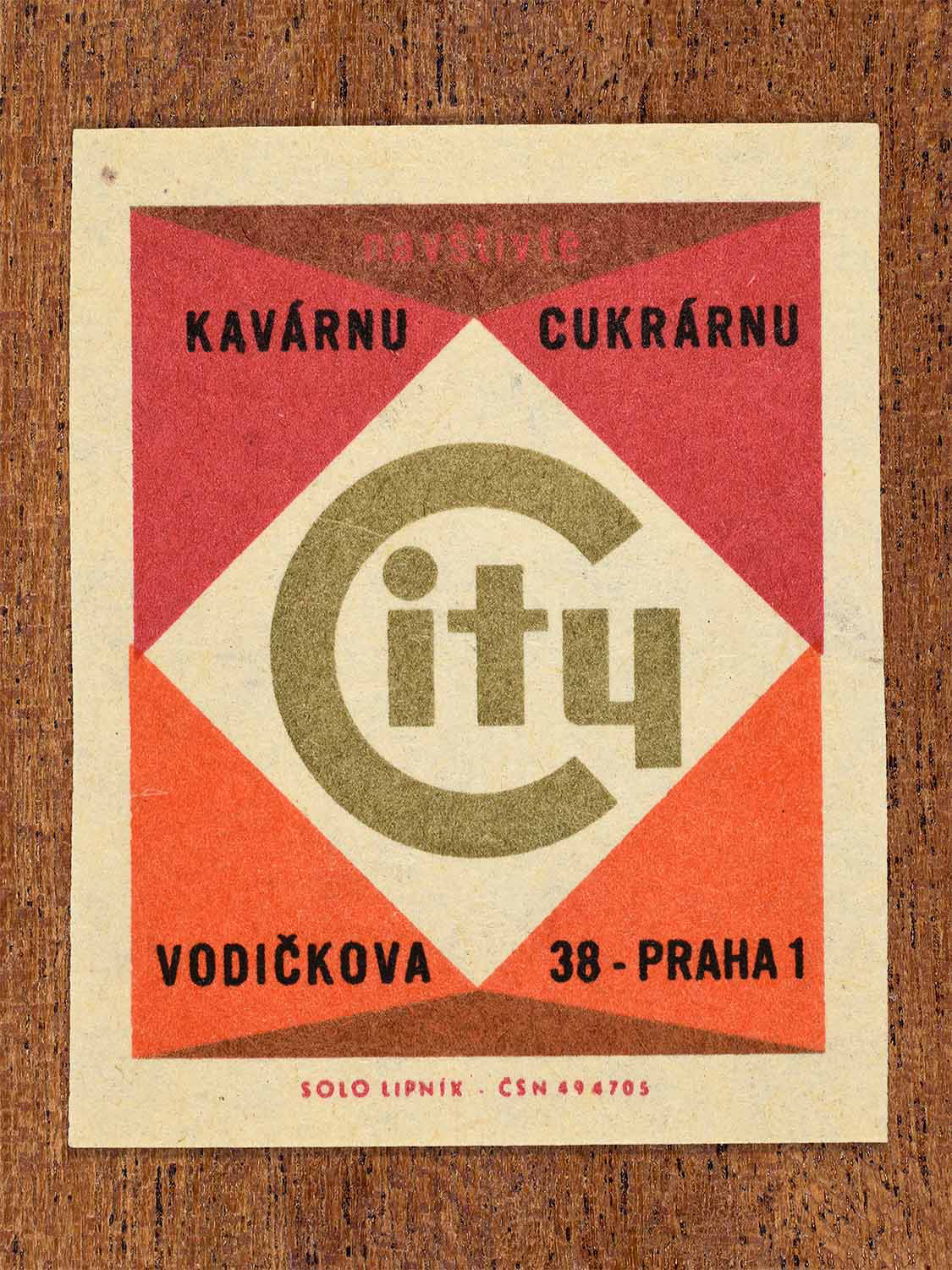Vintage c. 1967 Czech matchbox labels showing bold geometric lettering for City café and confectionery in red and and orange colours. Produced by the Solo Lipník match factory to promote a café in Prague.
