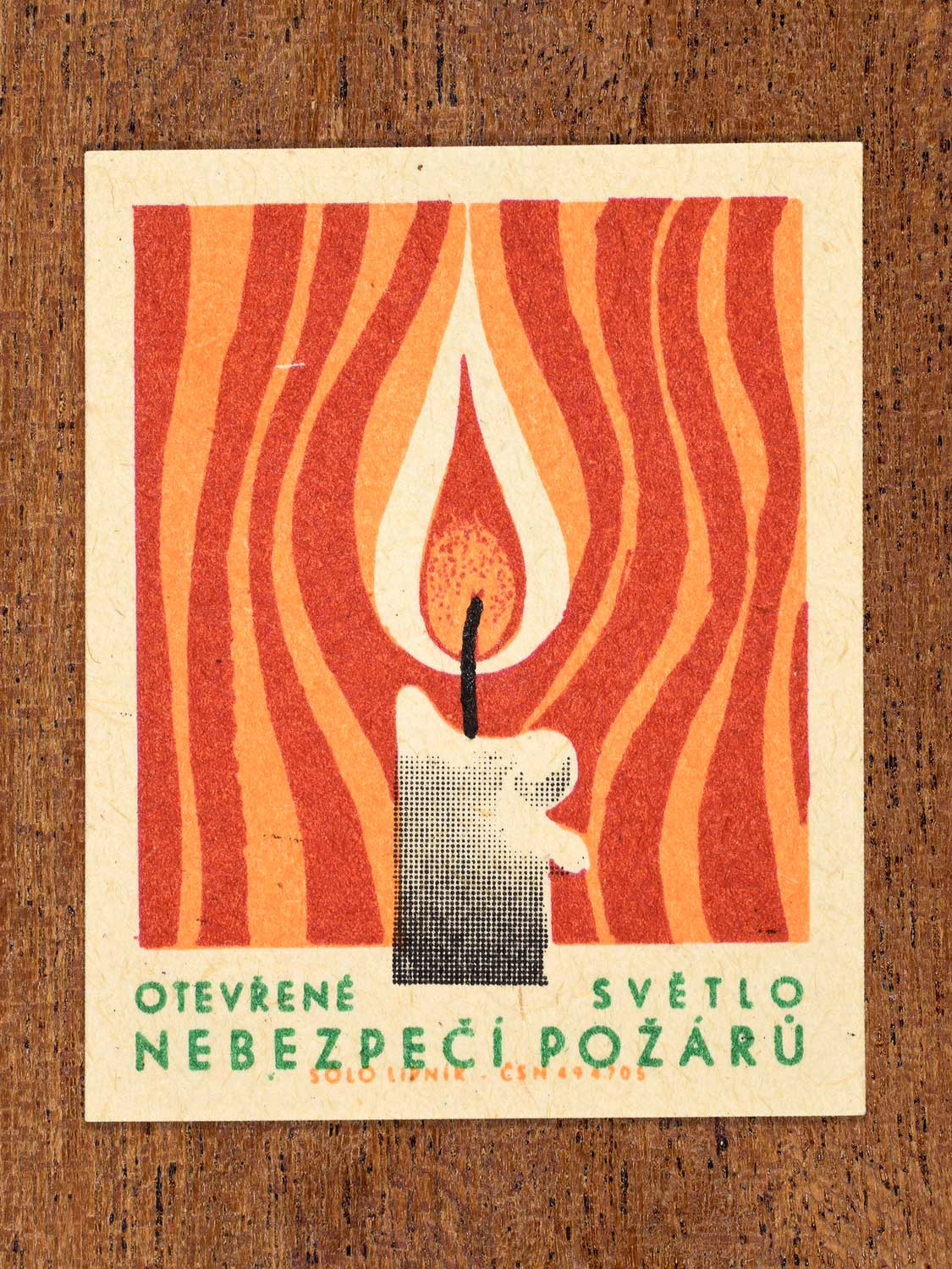 Vintage 1966 Czech matchbox label featuring a lit candle with heatwave lines in red and orange surrounding it. Produced by Solo Lipník match factory to promote the importance of fire safety precautions.