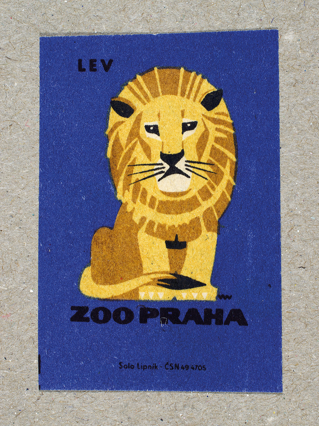 Vintage 1963 Czech matchbox label by Solo Lipník featuring a lion on a blue background. Part of the 'Zoo Praha' series advertising Prague Zoo in Czechoslovakia.