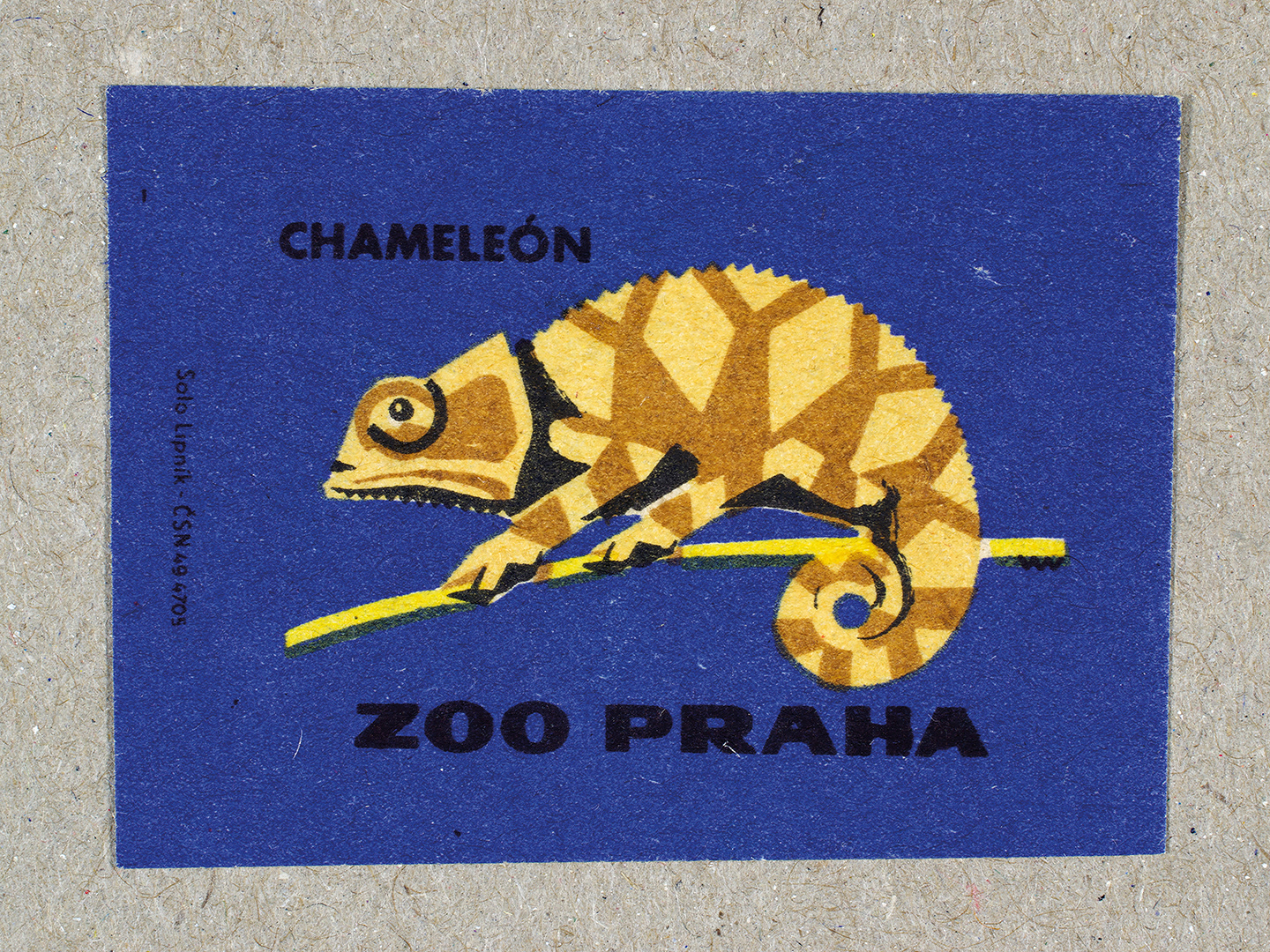 Vintage 1963 Czech matchbox label by Solo Lipník featuring a chameleon lizard on a blue background. Part of the 'Zoo Praha' series advertising Prague Zoo in Czechoslovakia.