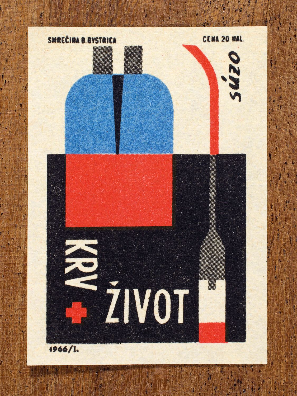 Vintage 1966 Czech matchbox label by Solo Smrečina B. Bystrica featuring a stylised graphic of a blood bag on a black and white background. It promotes awareness of supporting life through giving blood.