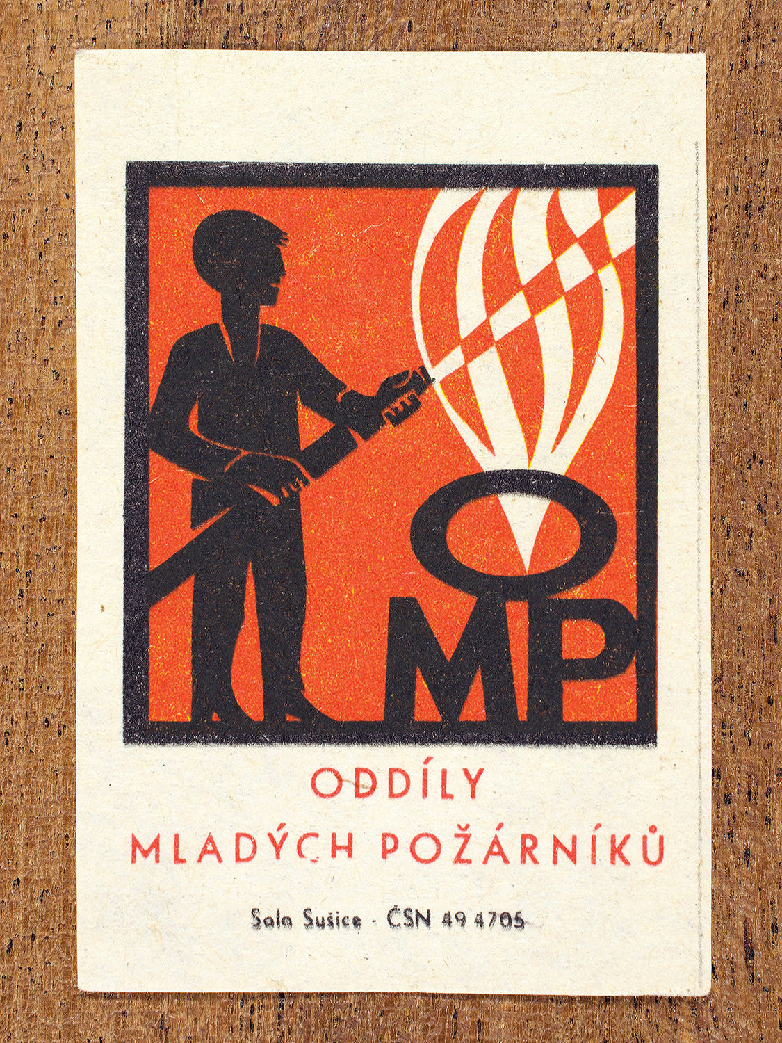 1968 Czechoslovak matchbox label by Solo Sušice showing a grinning devil with a cigarette in its mouth. Used as a public service message celebrating a movement encouraging fire safety awareness and volunteer training among children. Label 8 of 10 in the Fire Hazards Series.