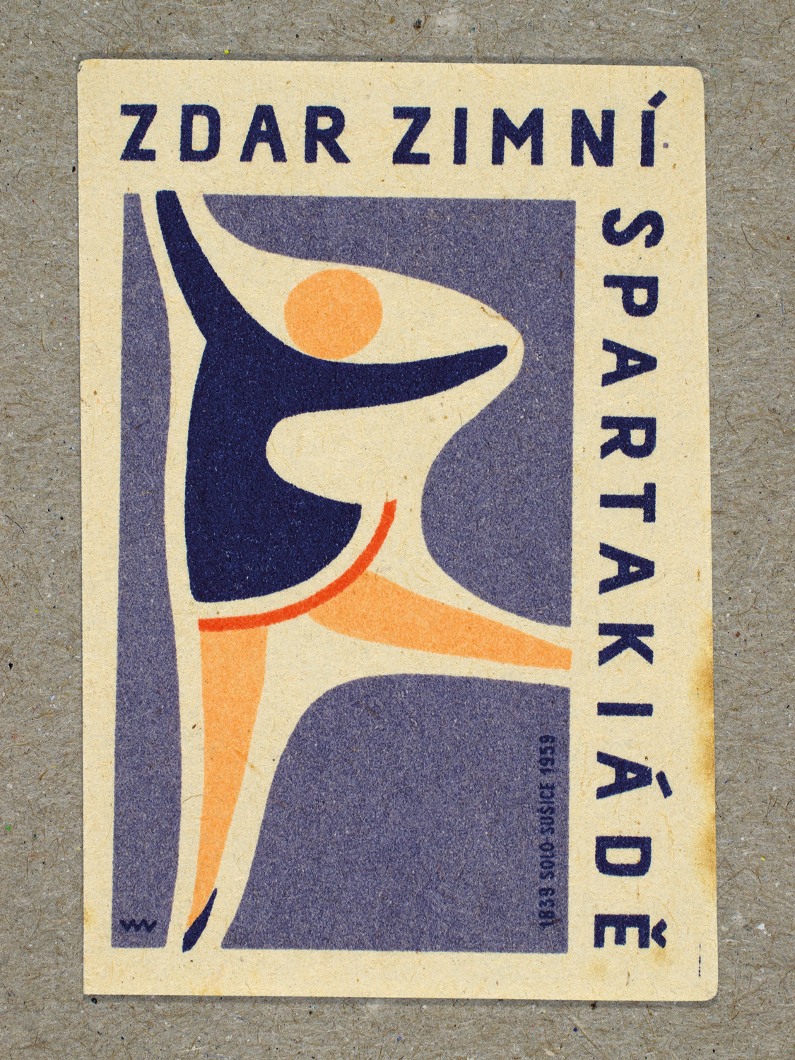 Vintage 1959 Czech matchbox label featuring a stylised figure on skates performing a ballet pose, in blue and red colours. Produced by Solo Lipník & Solo Sušice match factory to promote the nationwide Spartakiad sports programme in Czechoslovakia.