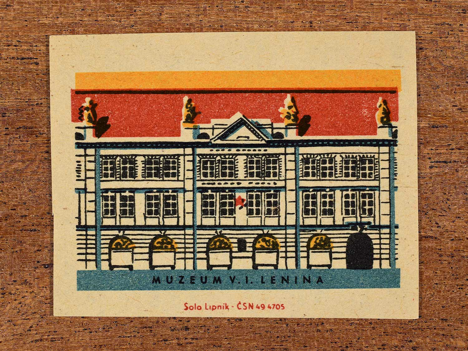 Vintage 1964 Czechoslovakia matchbox label showing the Muzeum V.I. Lenina (Lenin Museum) in yellow, red and teal colours. Produced by the Solo Lipník match factory to promote domestic historical heritage and municipal institutions across the state.
