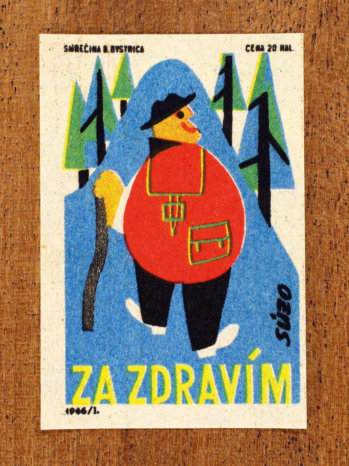 Vintage 1966 Czech matchbox label by Solo Smrečina B. Bystrica featuring a smiling figure with a large red backpack and walking stick, hiking through woodland. It promotes the benefits of getting outdoors and staying active to support both physical and mental wellbeing.