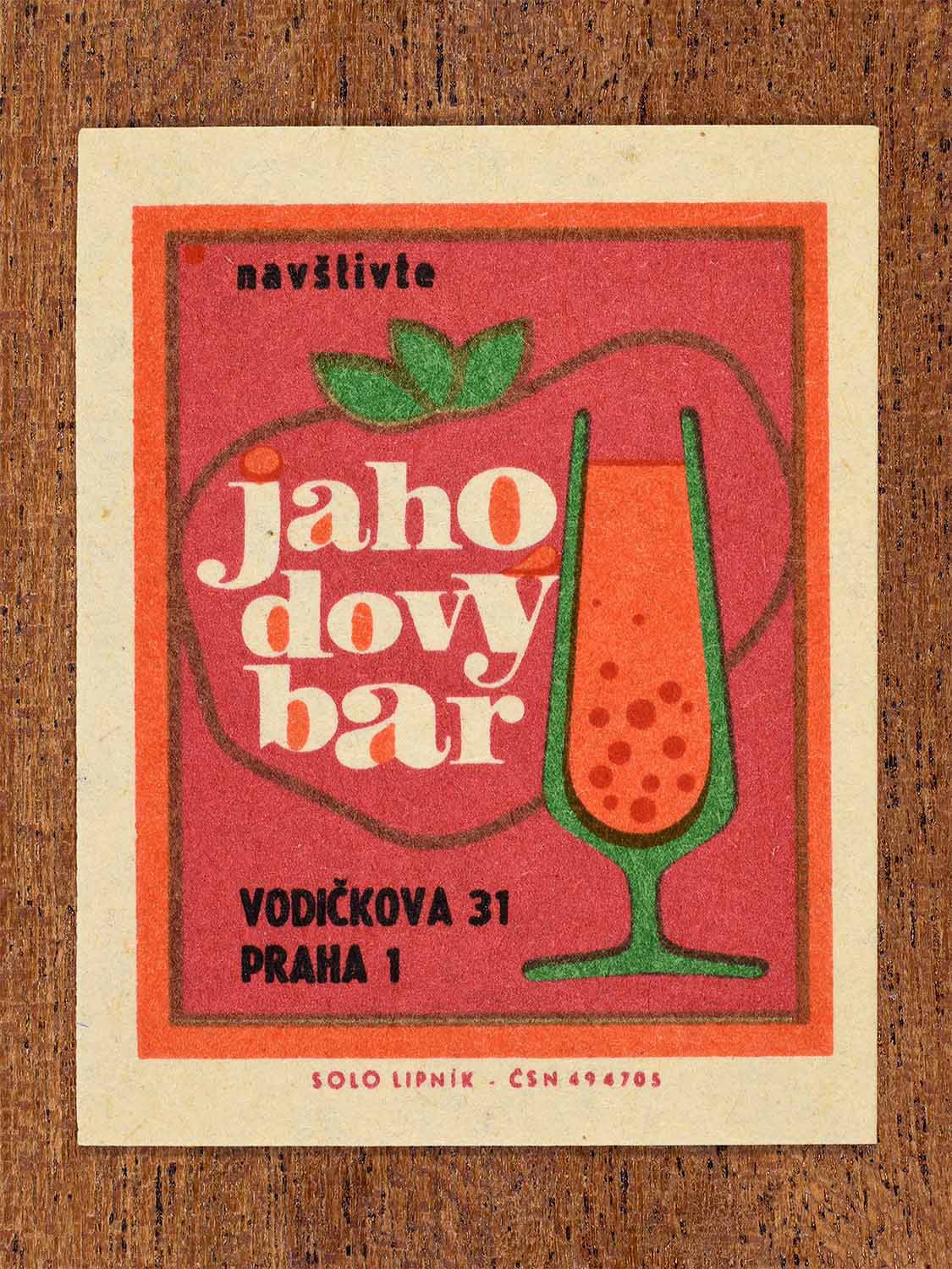 Vintage c. 1967 Czech matchbox labels showing a large strawberry and a tall drink glass in red and green. Produced by the Solo Lipník match factory to promote the Strawberry Bar in Prague.