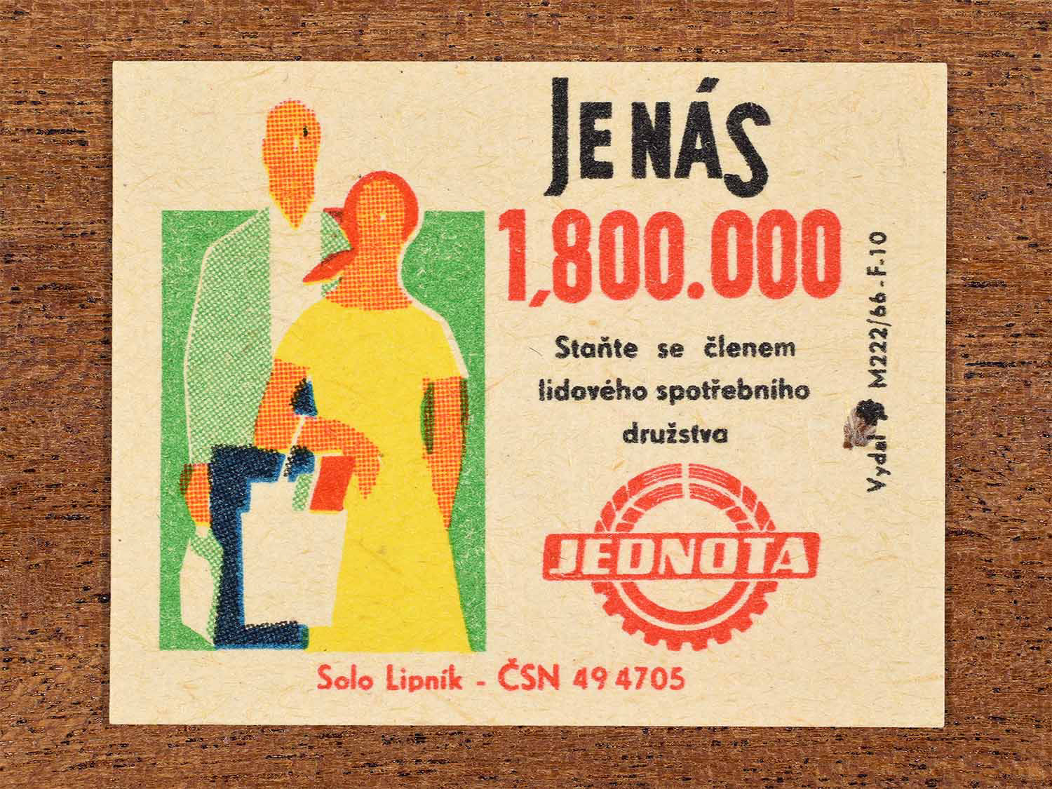 Vintage c. 1966 Czech matchbox label showing a stylised couple carrying shopping bags in bright geometric colours. Produced by the Solo Lipník match factory to encourage membership in the Jednota people’s consumer cooperative.