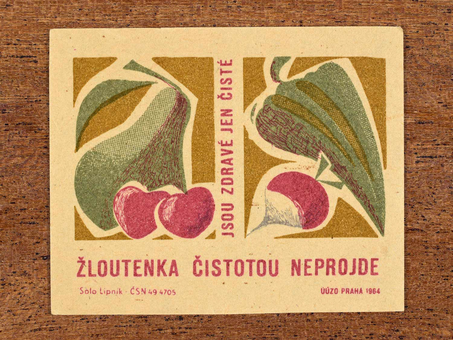 Vintage 1964 Czech matchbox label showing stylised fruits and vegetables. Produced by the Solo Lipník match factory to promote washing food before eating in the prevention of infectious jaundice (hepatitis).