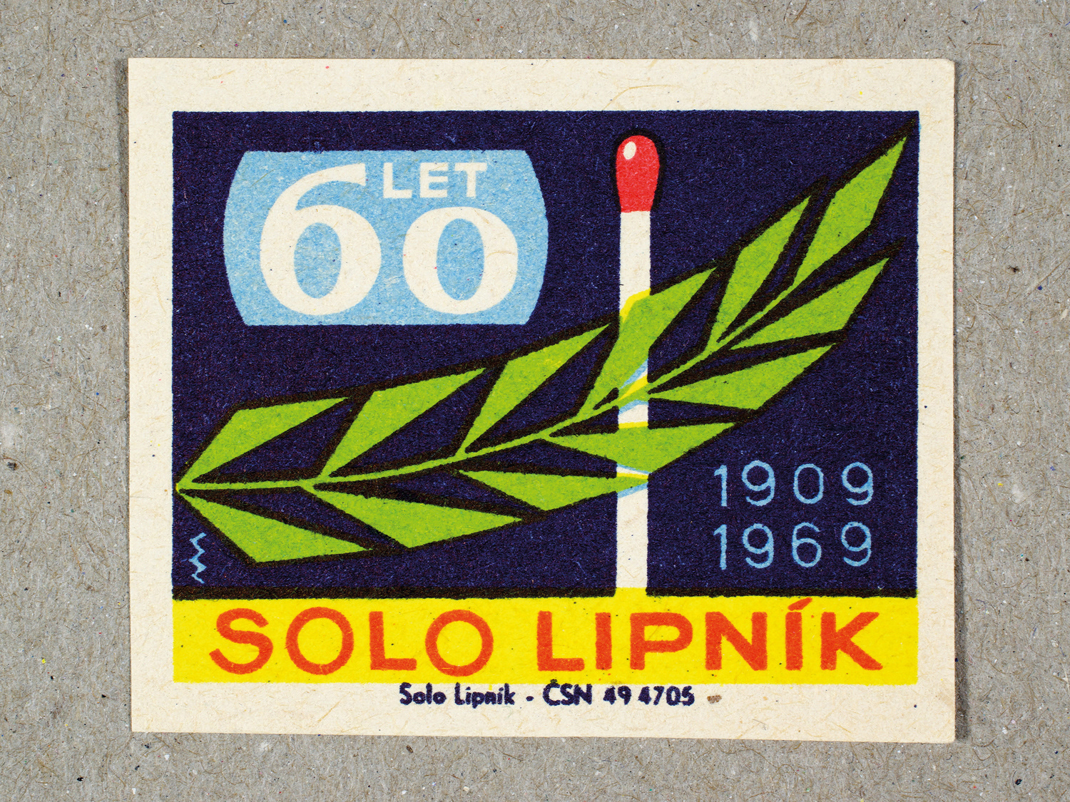 Vintage 1969 Czech matchbox label by Solo Lipník featuring a matchstick and leaf with blue, green and yellow colors. Part of the 'SOLO Lipník Anniversary' series advertising the Czechoslovakian match factory.
