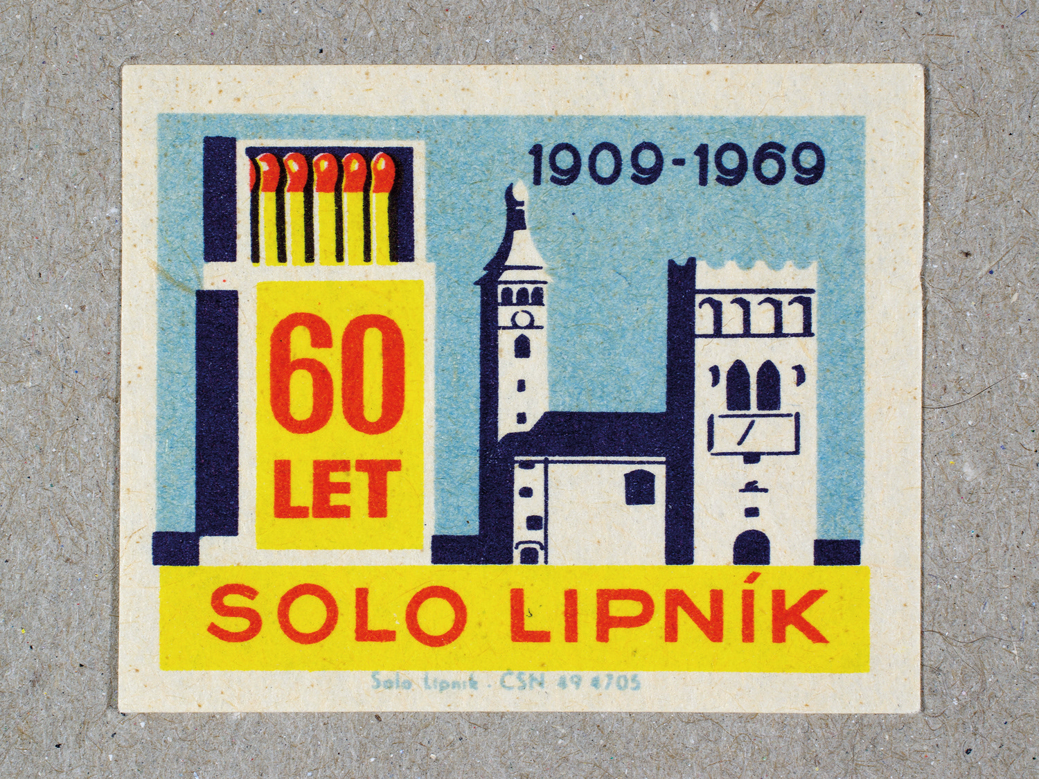 Vintage 1969 Czech matchbox label by Solo Lipník featuring an open matchbox and building with blue and yellow colors. Part of the 'SOLO Lipník Anniversary' series advertising the Czechoslovakian match factory.