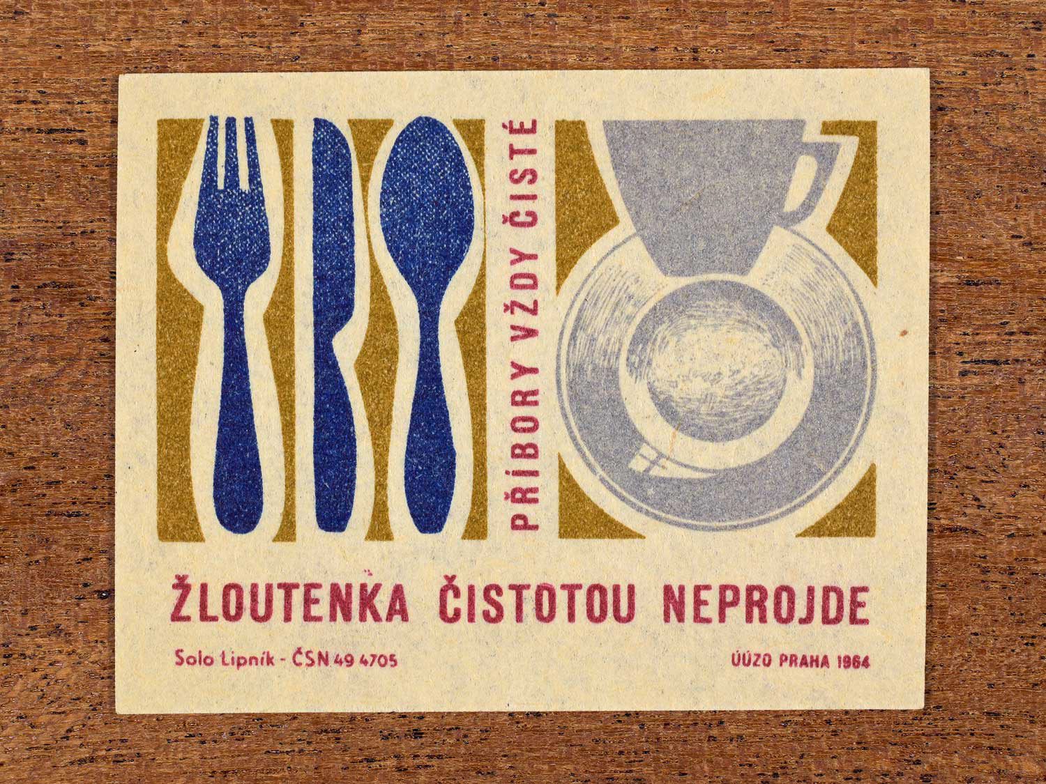 Vintage 1964 Czech matchbox label showing stylised cutlery and dishes. Produced by the Solo Lipník match factory to promote clean tableware in the prevention of infectious jaundice (hepatitis).