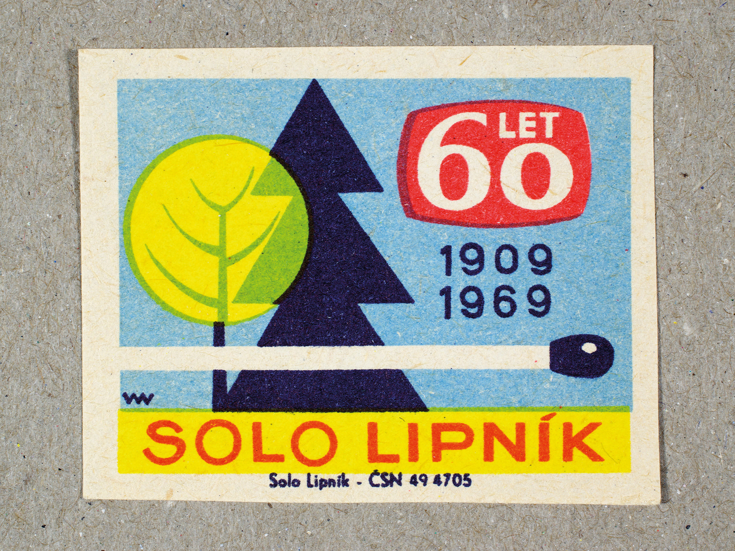 Vintage 1969 Czech matchbox label by Solo Lipník featuring a matchstick and two trees in blue and yellow colours. Part of the 'SOLO Lipník Anniversary' series advertising the Czechoslovakian match factory.