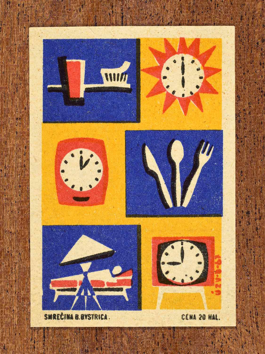 Vintage 1967 Czech matchbox label showing a toothbrush and clock at 6am, cutlery and a clock at 1pm and a bed and clock at 9pm. In red, yellow and blur colours. Produced by the Smrečná match factory, Banská Bystrica, to promote structured daily routines for good health.