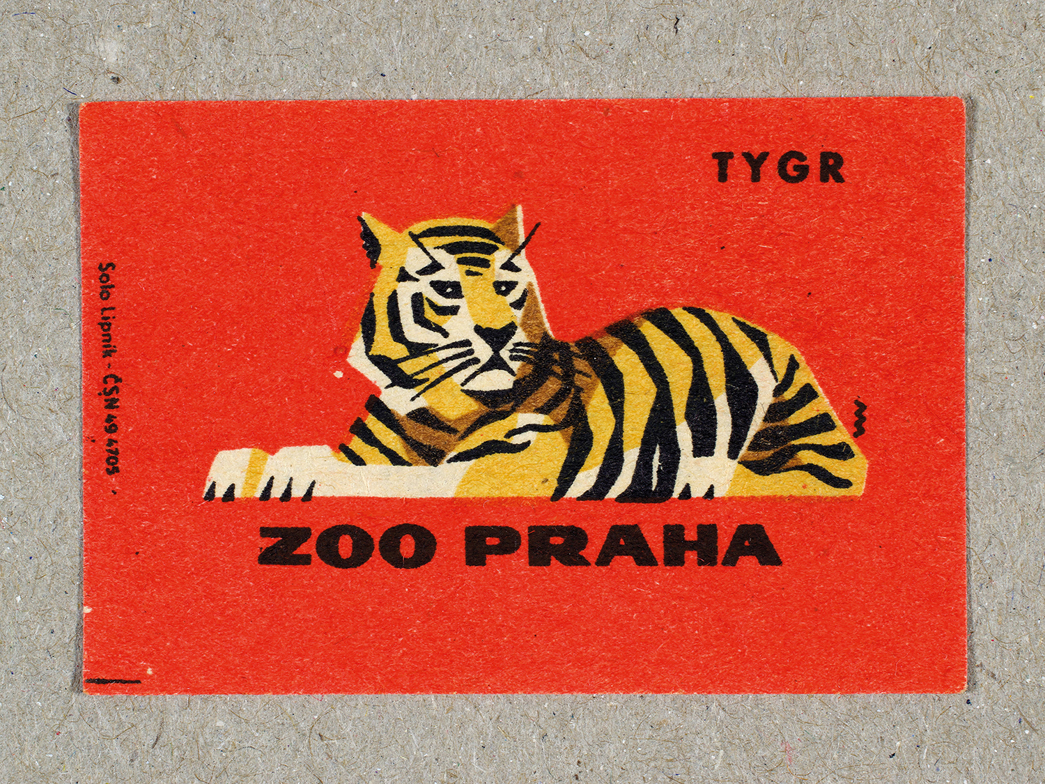 Vintage 1963 Czech matchbox label by Solo Lipník featuring a tiger on a red background. Part of the 'Zoo Praha' series advertising Prague Zoo in Czechoslovakia.