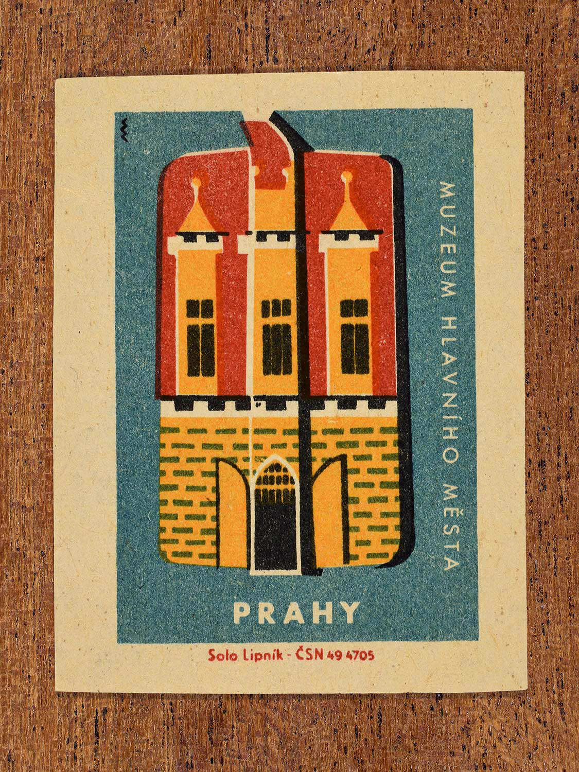 Vintage 1964 Czechoslovakia matchbox label showing the Muzeum Hlavního Města Prahy (Museum of the Capital City of Prague) in yellow, red and teal colours. Produced by the Solo Lipník match factory to promote domestic historical heritage and municipal institutions across the state.