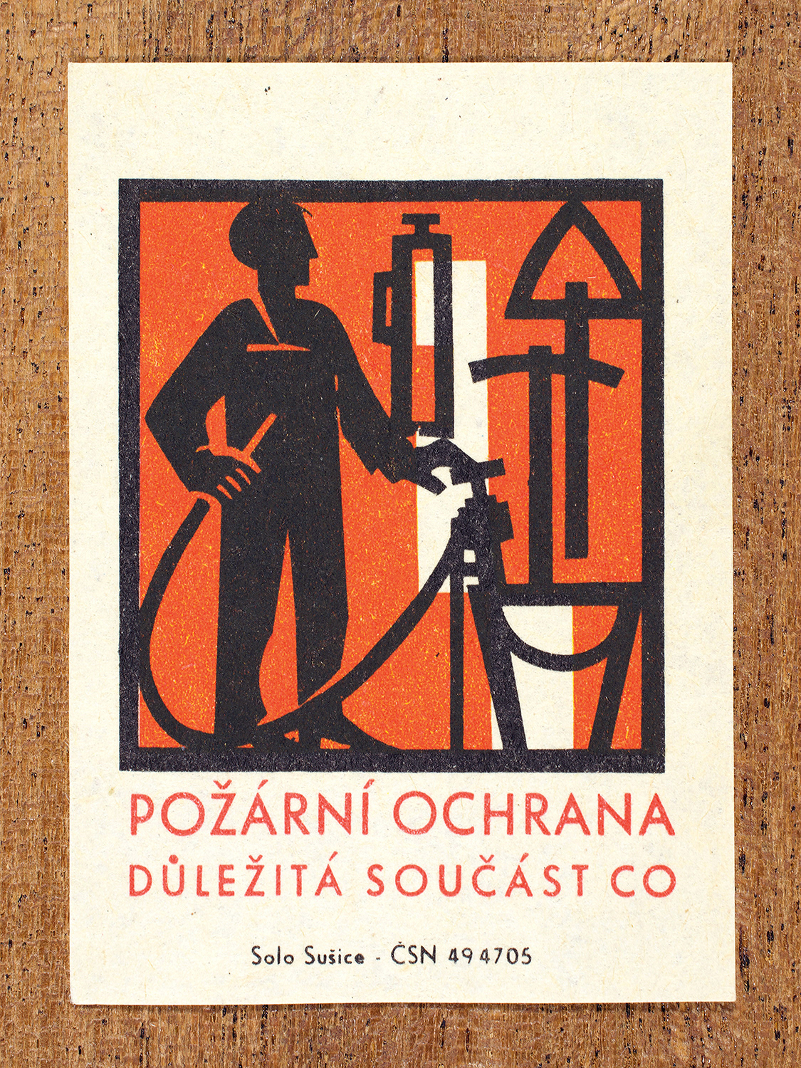 1968 Czechoslovak matchbox label by Solo Sušice showing a grinning devil with a cigarette in its mouth. Used as a public service message reinforcing the idea that fire prevention was not just a household concern but a patriotic and collective duty. Label 9 of 10 in the Fire Hazards Series.