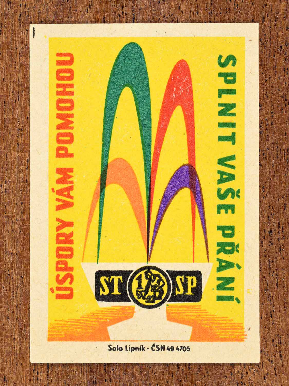 Vintage 1960 Czech matchbox label showing abstract upward shapes in bright colours. Produced by the Solo Lipník match factory to promote savings as a way to fulfil personal wishes.