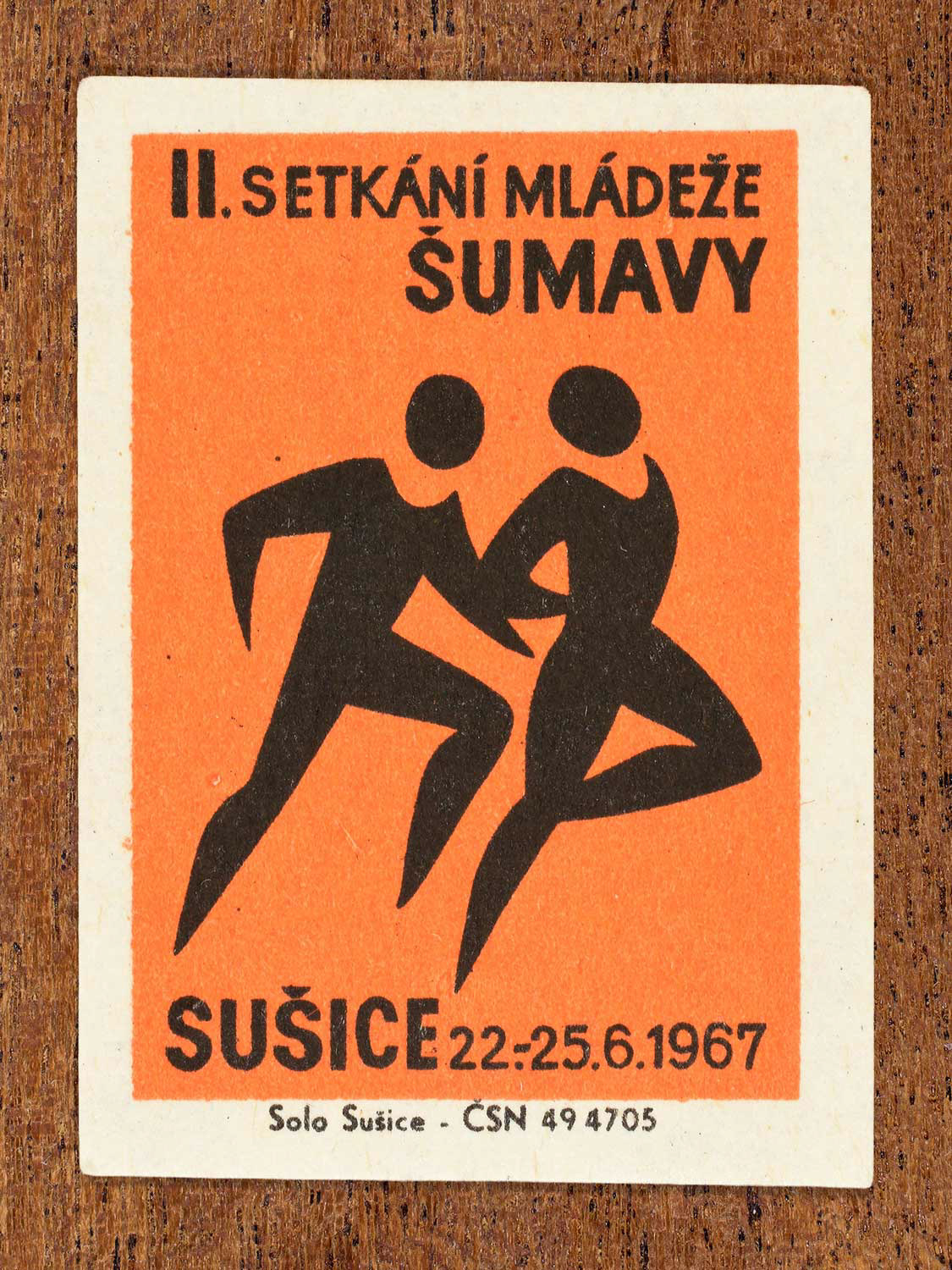 Vintage 1967 Czech matchbox label showing two youths dancing together. Produced by the Solo Sušice match factory to promote collective celebration and social participation.