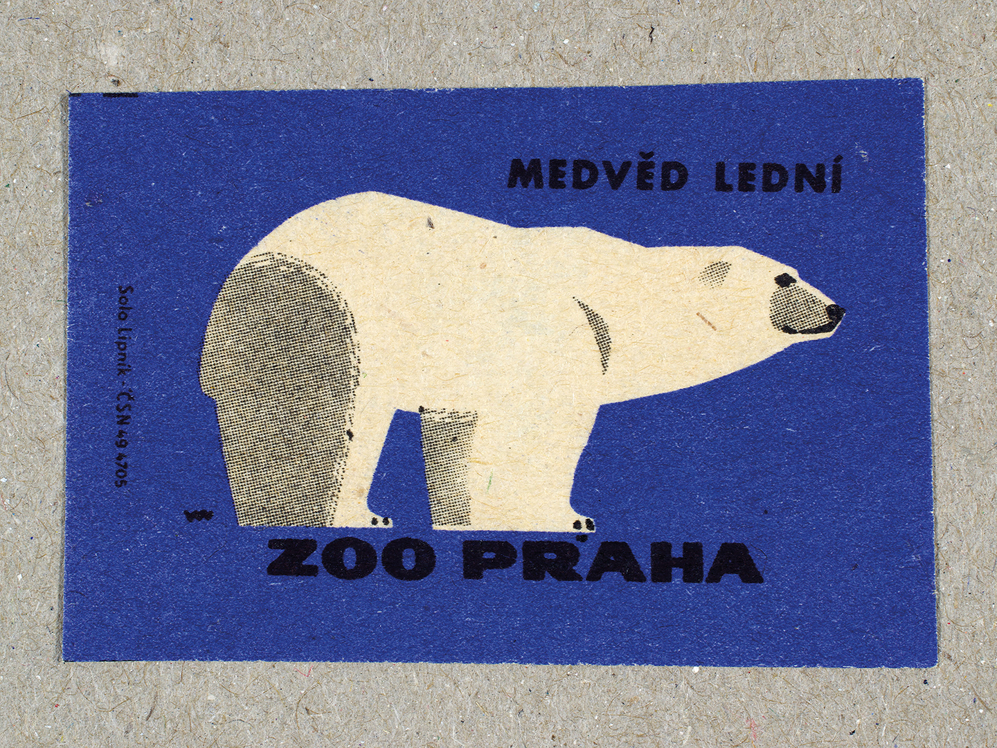 Vintage 1963 Czech matchbox label by Solo Lipník featuring a polar bear on a blue background. Part of the 'Zoo Praha' series advertising Prague Zoo in Czechoslovakia.