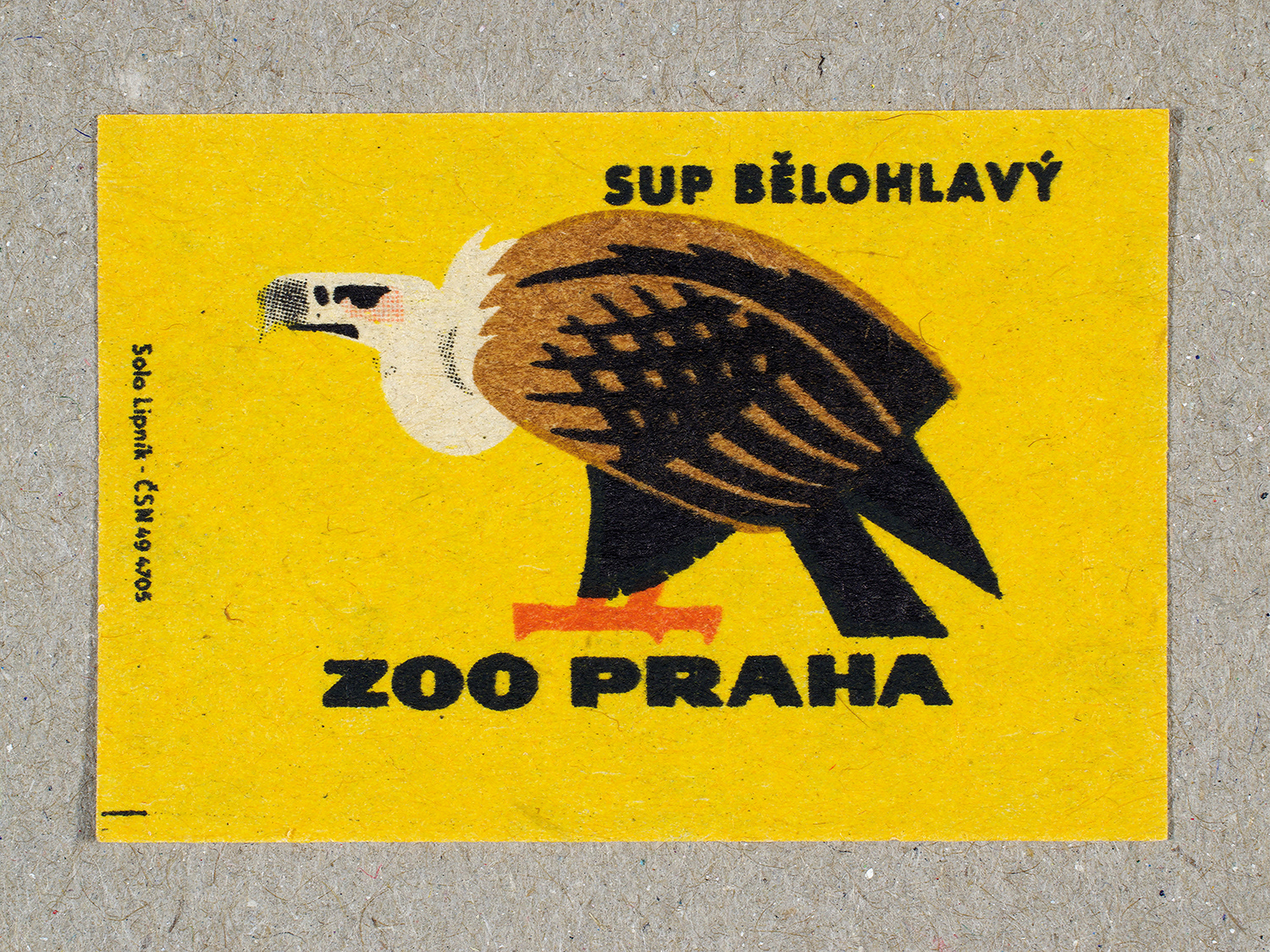 Vintage 1963 Czech matchbox label by Solo Lipník featuring a griffon vulture on a yellow background. Part of the 'Zoo Praha' series advertising Prague Zoo in Czechoslovakia.