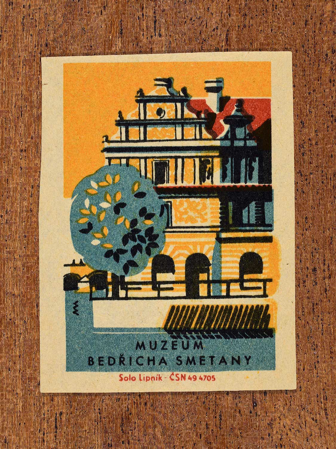 Vintage 1964 Czechoslovakia matchbox label showing a detailed front facade of the Bedřich Smetana Museum building in yellow, blue and red colours. Produced by the Solo Lipník match factory to promote domestic historical heritage and municipal institutions across the state.