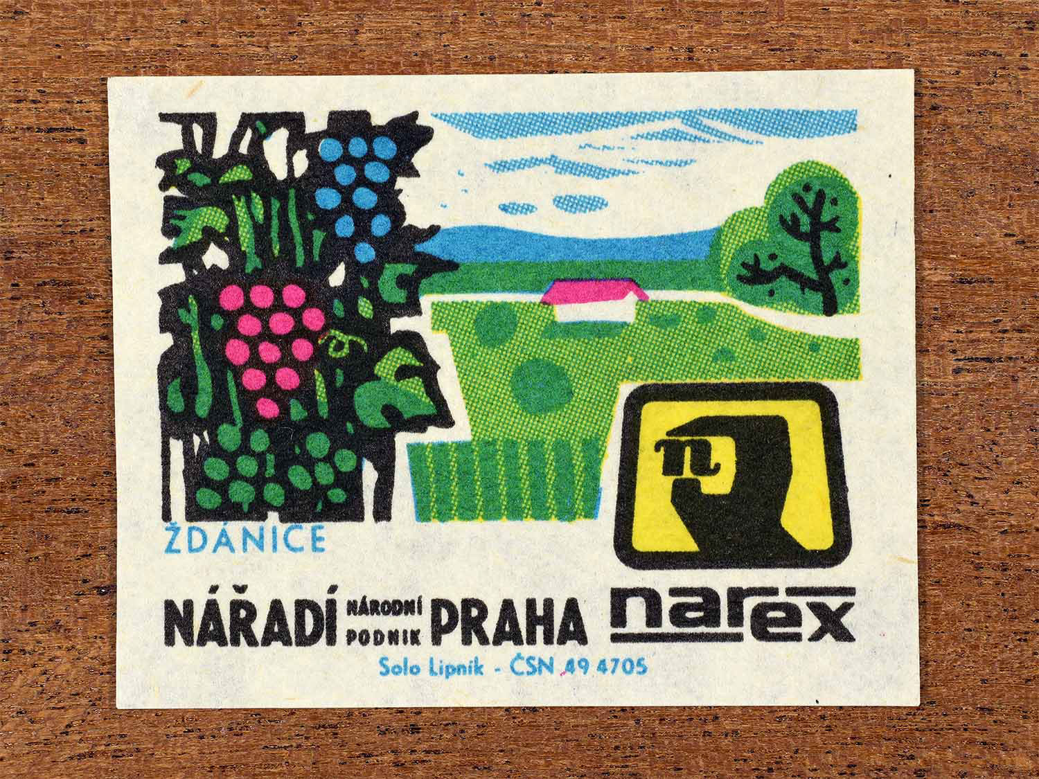 Vintage 1967 Czech matchbox label showing vineyards and agricultural landscape with grapevines and rolling fields in bright green, blue, and pink. Produced by the Solo Lipník match factory to promote Ždánice and Narex, the national tool enterprise in Czechoslovakia.