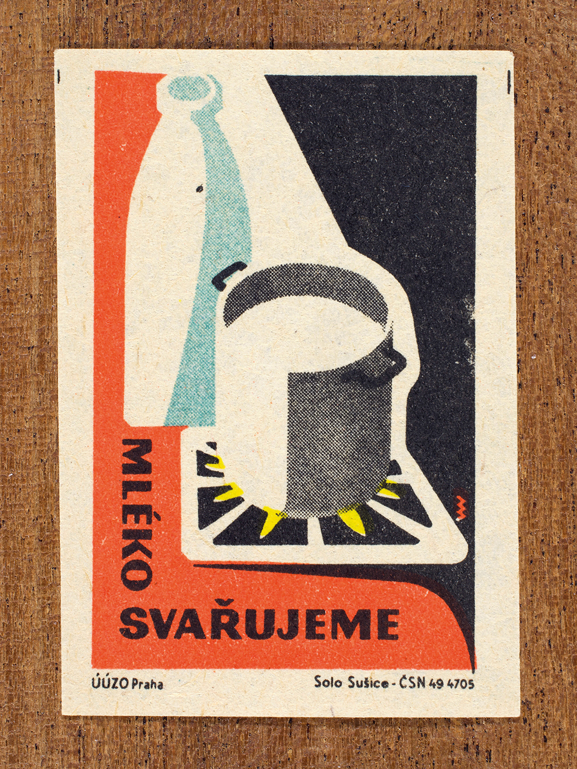 Vintage 1962 Czech matchbox label by Solo Sušice featuring a milk bottle and saucepan on a stove. Part of the 'Food Handling' series reminding households to boil milk before drinking to kill bacteria.