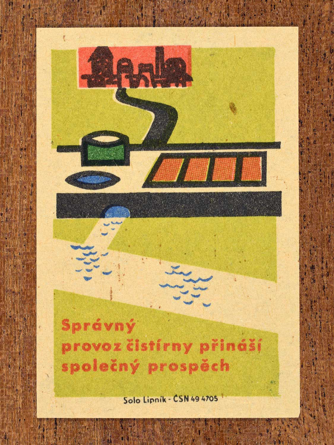 Vintage c. 1963 Czech matchbox label showing a water treatment plant cleaning wastewater, in green, red and black colours. Produced by Solo Lipník match factory advising that proper plant operation benefits everyone.