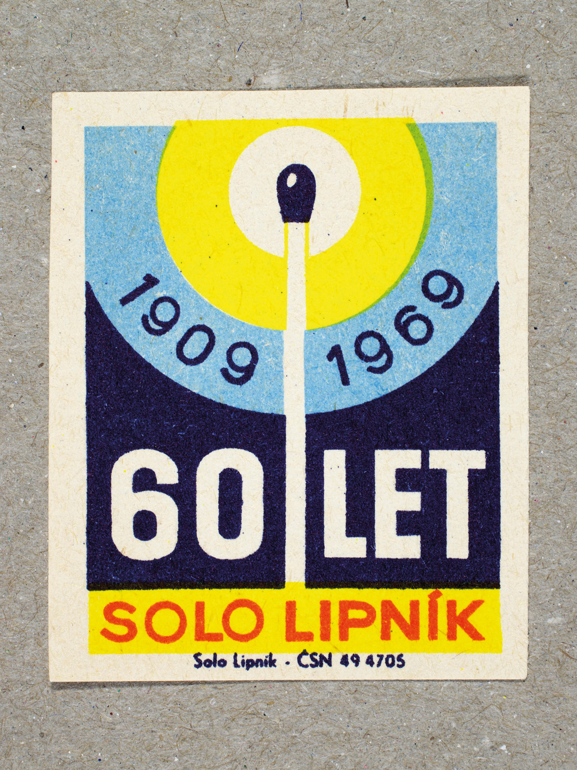 Vintage 1969 Czech matchbox label by Solo Lipník featuring a matchstick design with bold blue and yellow colours. Part of the 'SOLO Lipník Anniversary' series advertising the Czechoslovakian match factory.