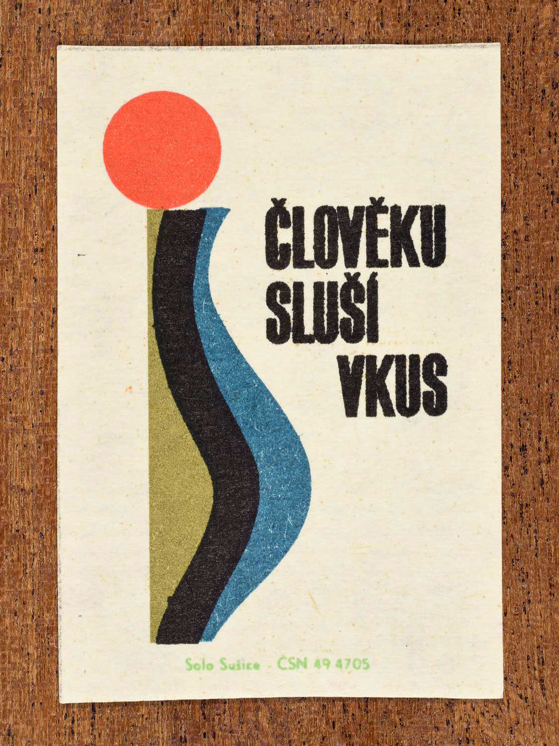 Vintage c. 1966 Czech matchbox label showing a abstract form topped with a circular accent. Produced by the Solo Sušice match factory to promote good taste, refinement, and aesthetic judgement.