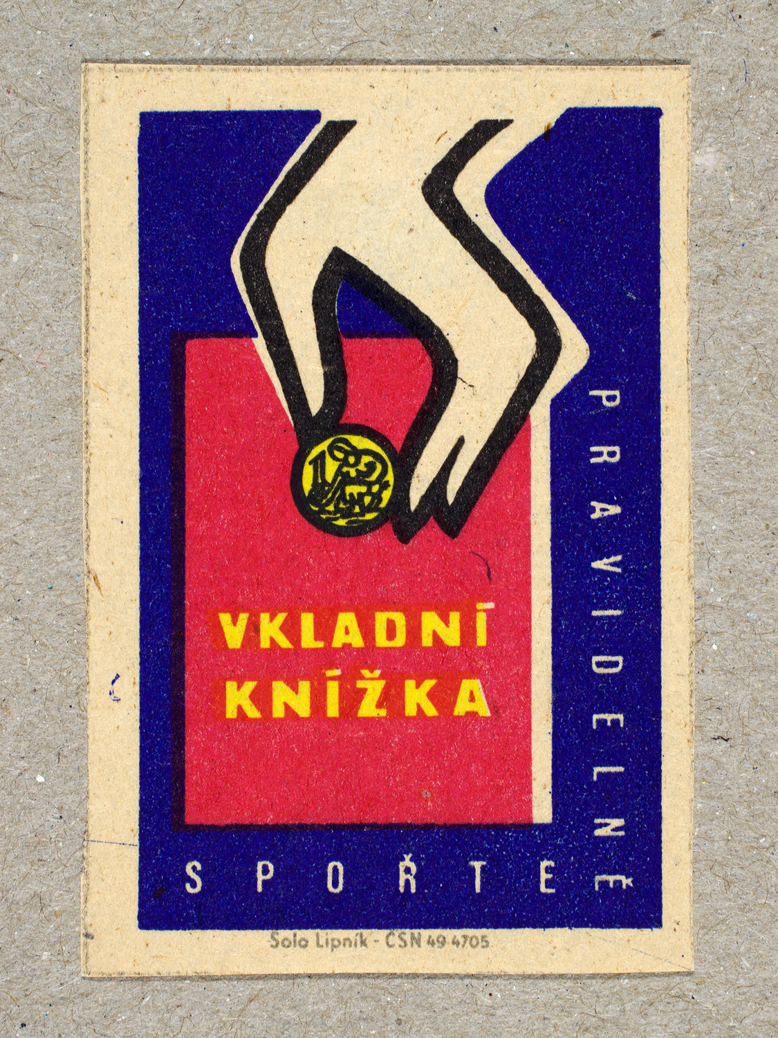 Vintage 1963 Czech matchbox label by Solo Lipník featuring a stylised hand droping a coin into a savings book, printed in red and blue. Part of the 'Savings Bank' series promoting financial discipline.