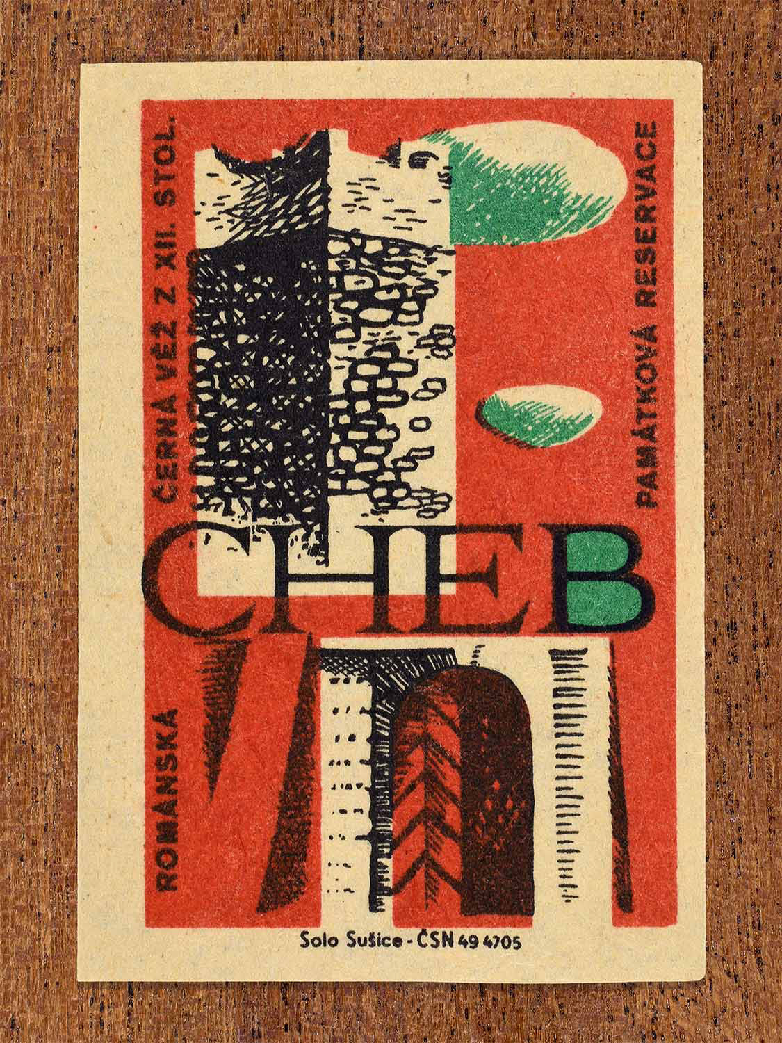 Vintage 1964 Czech matchbox label showing the Romanesque Black Tower from the 12th century in Cheb, in red and green colours. Produced by the Solo Sušice match factory to promote awareness of protected historic monuments.